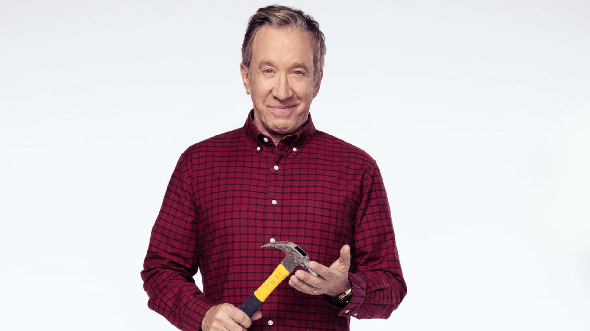 Actor Tim Allen Strikes A Charming Pose Background