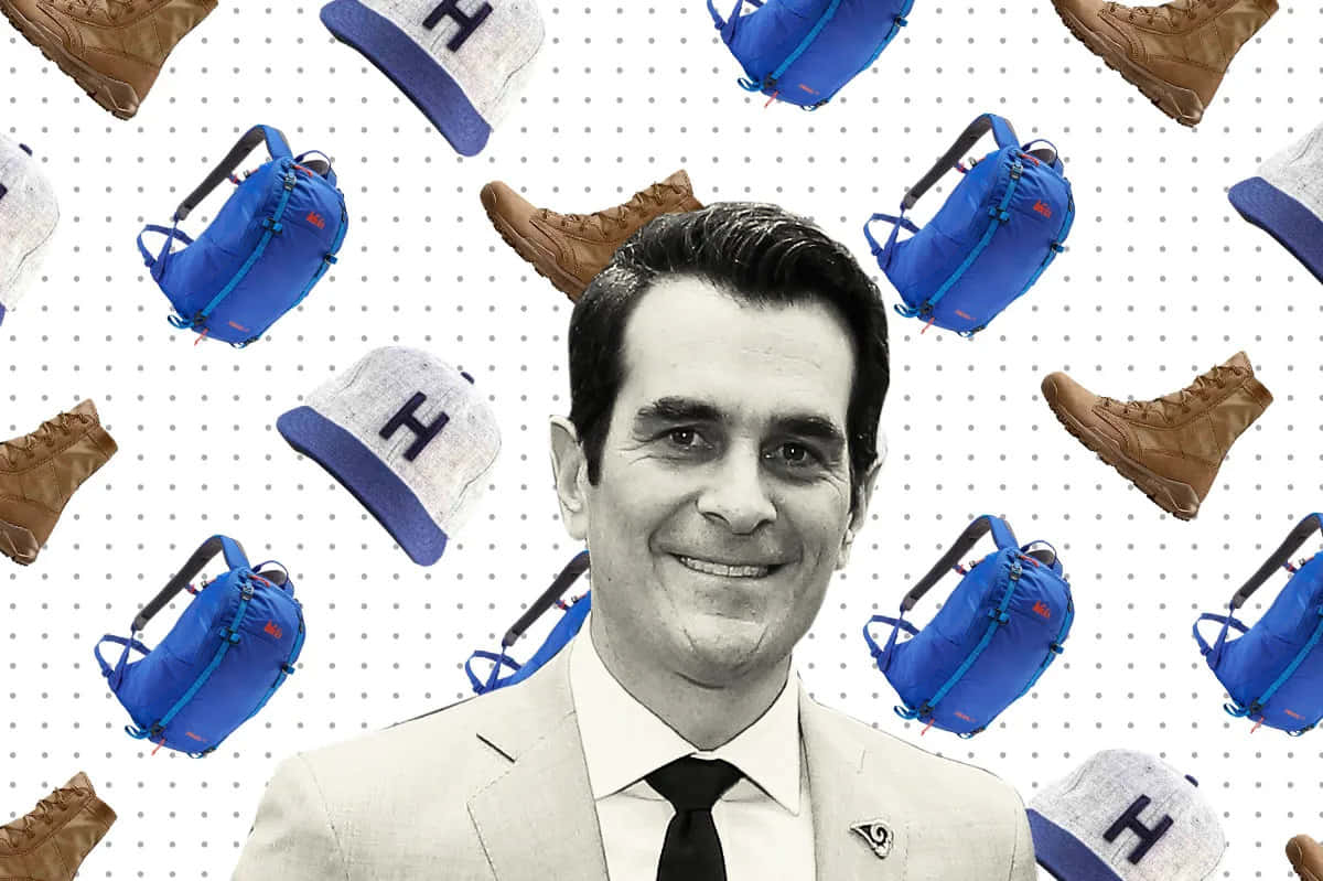 Actor Ty Burrell Smiling At A Photoshoot Background