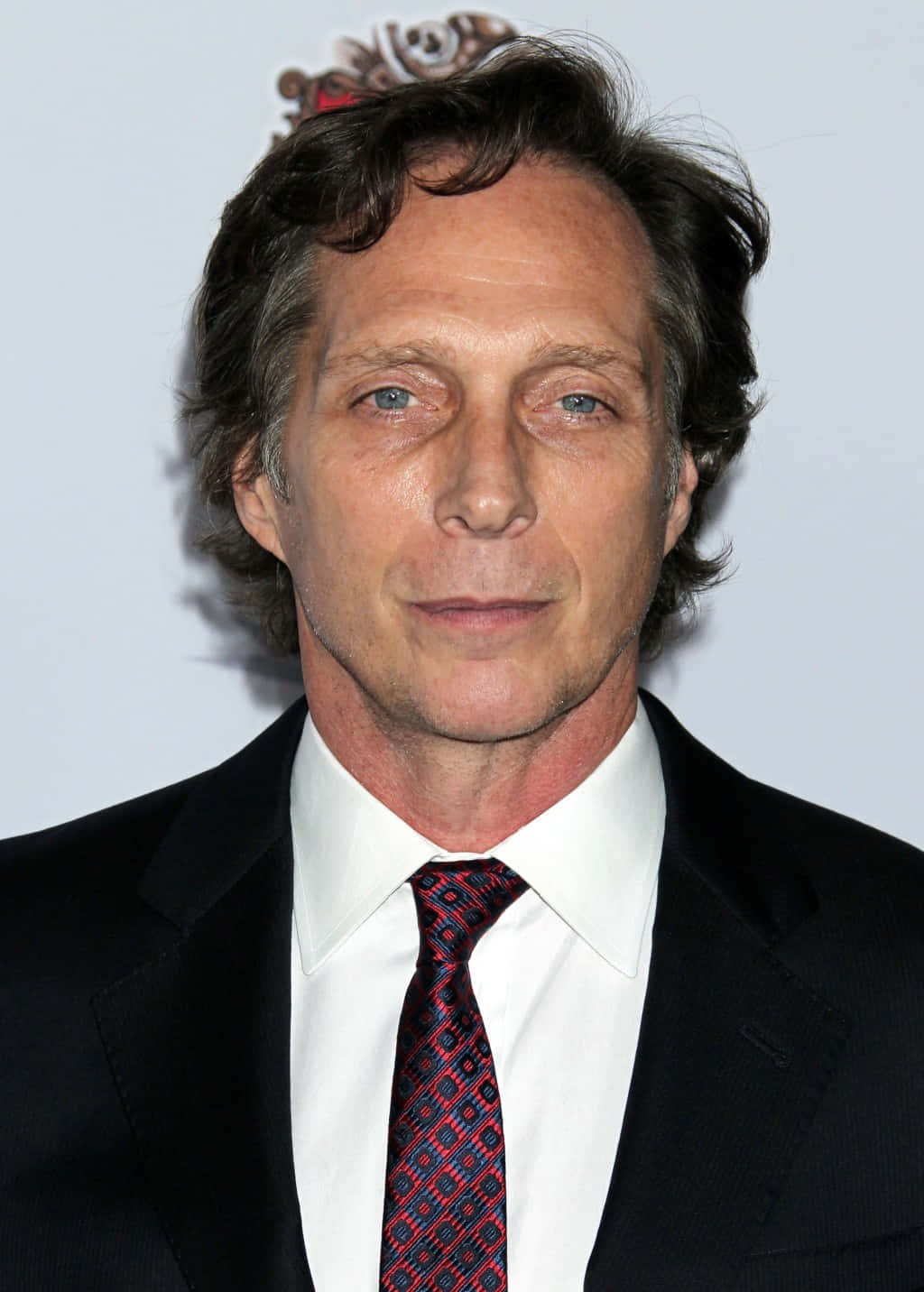 Actor William Fichtner In A Contemplative Pose Background