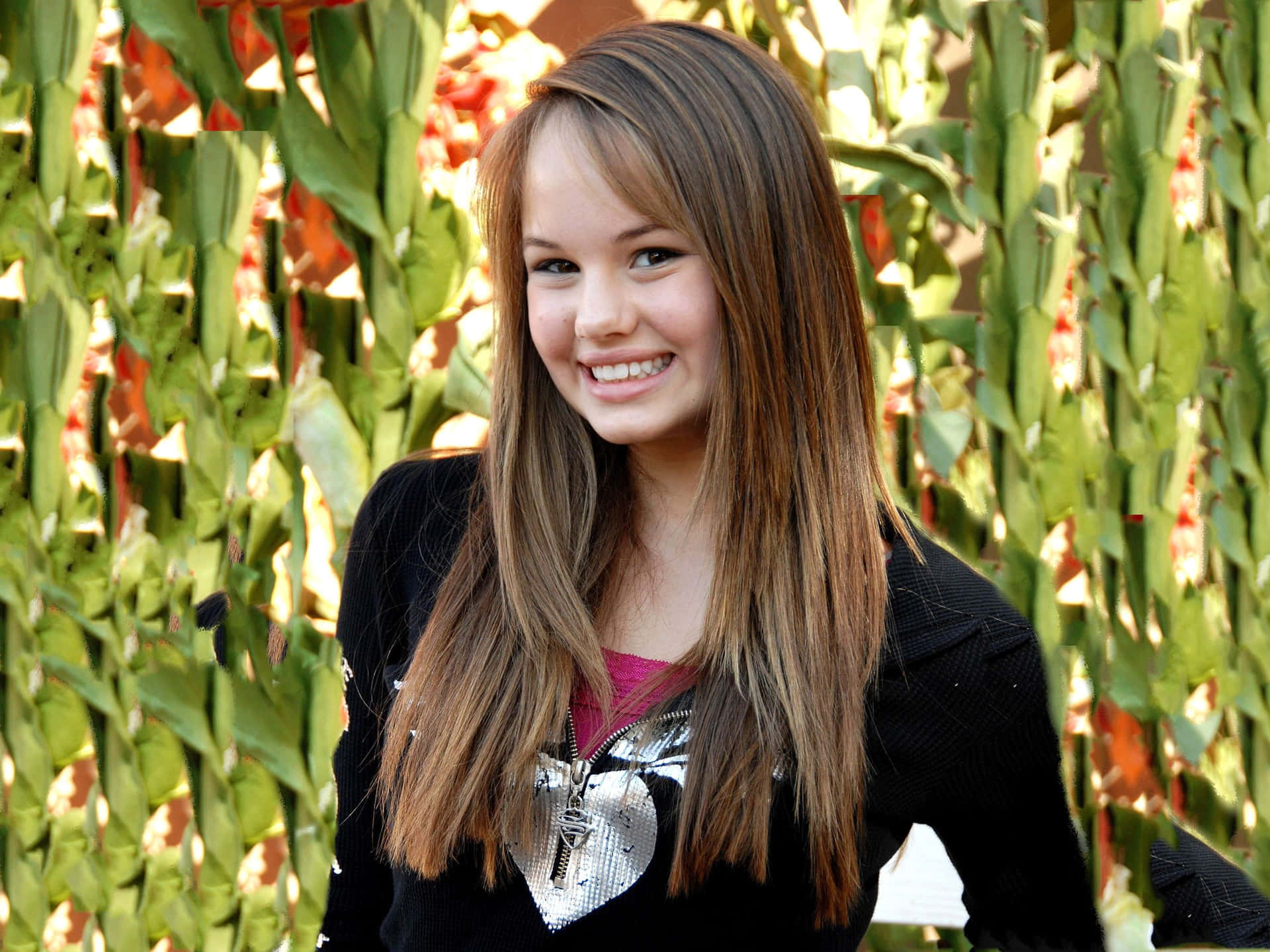 Actress Debby Ryan Strikes A Pose. Background