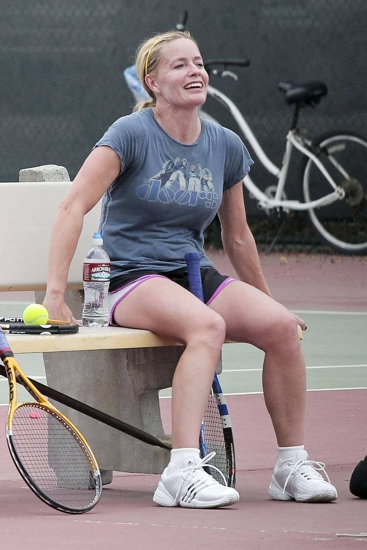 Actress Elisabeth Shue Posing With Her Tennis Racket Background