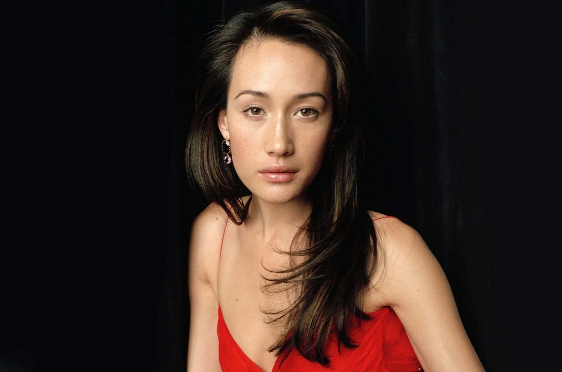 Actress Maggie Q Poses Elegantly Background