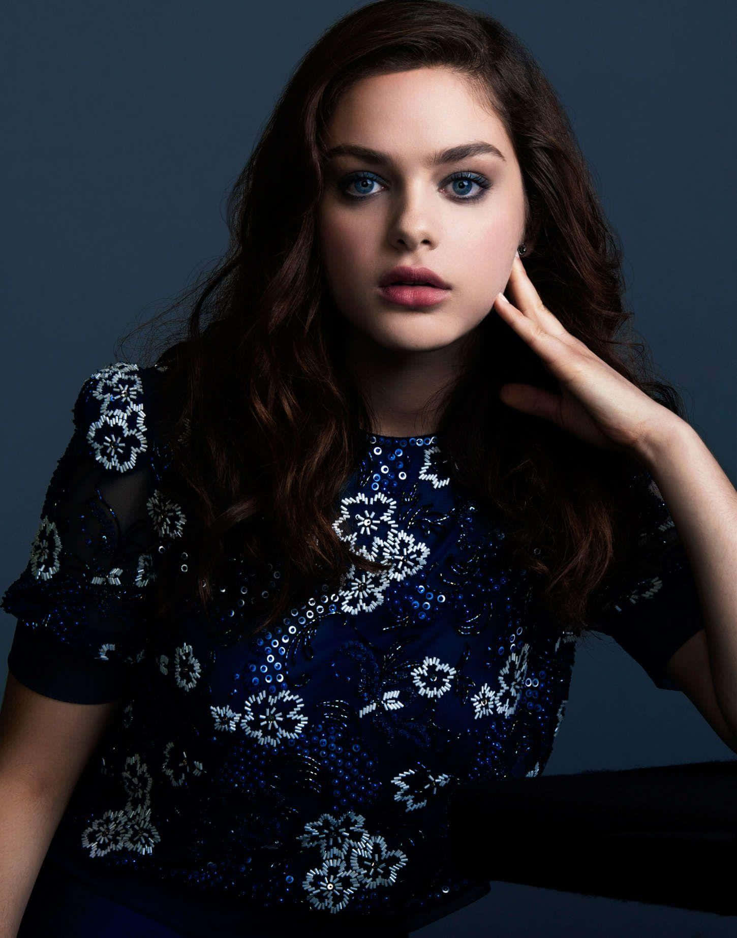 Actress Odeya Rush Strikes A Confident Pose Background