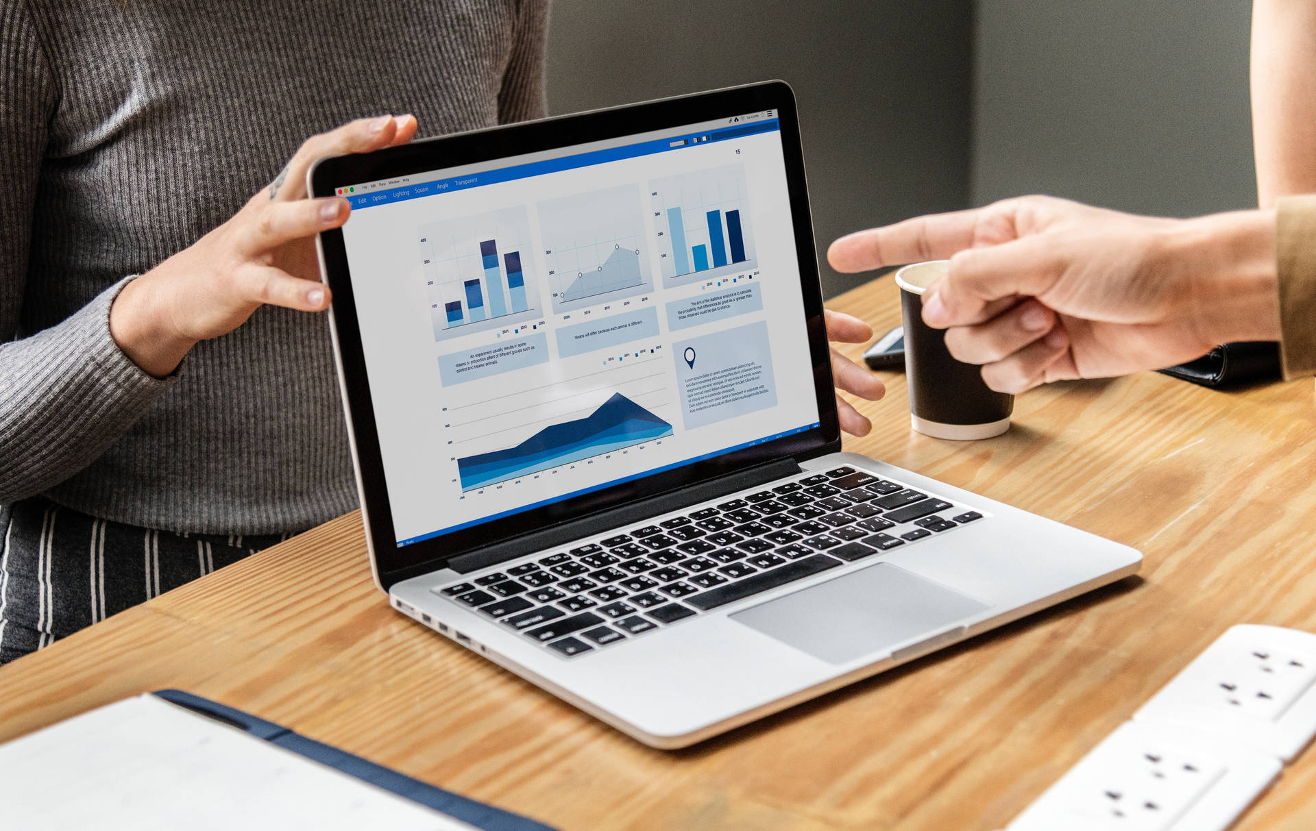 Actuaries Analyzing Statistical Data At A Business Meeting Background