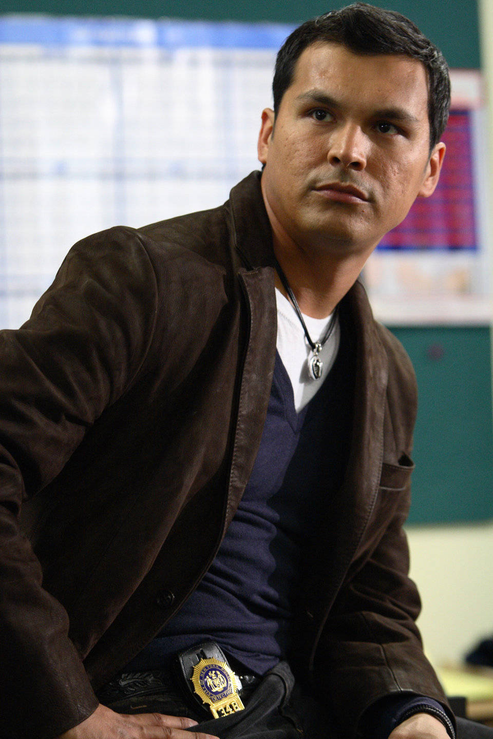 Adam Beach In Stylish Brown Jacket Background