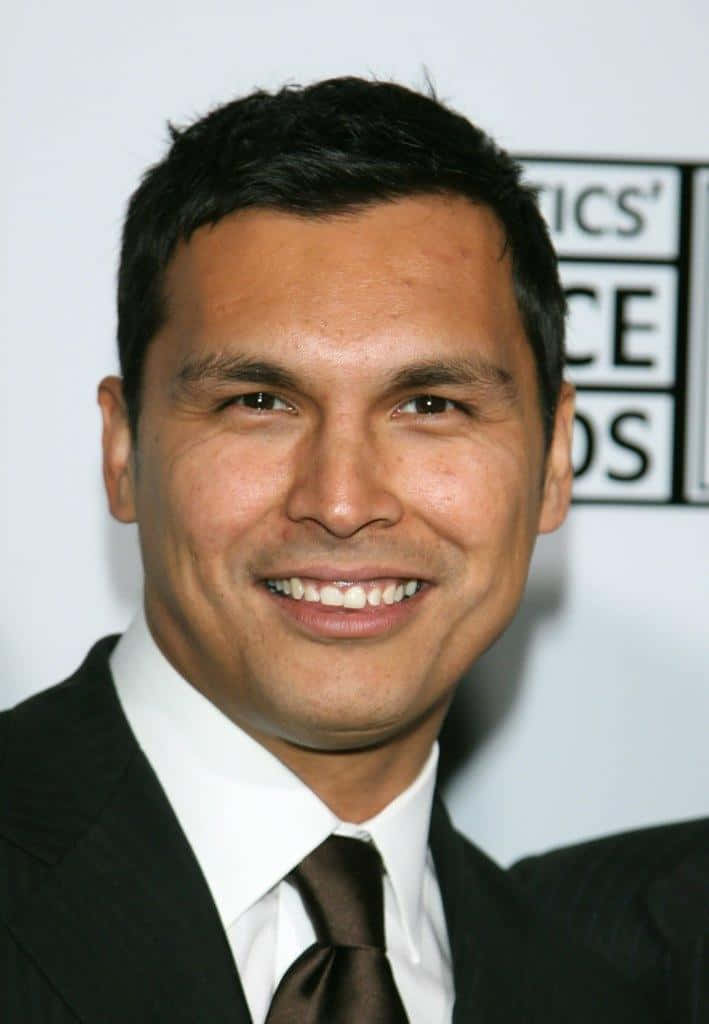 Adam Beach Smilingin Suitat Event