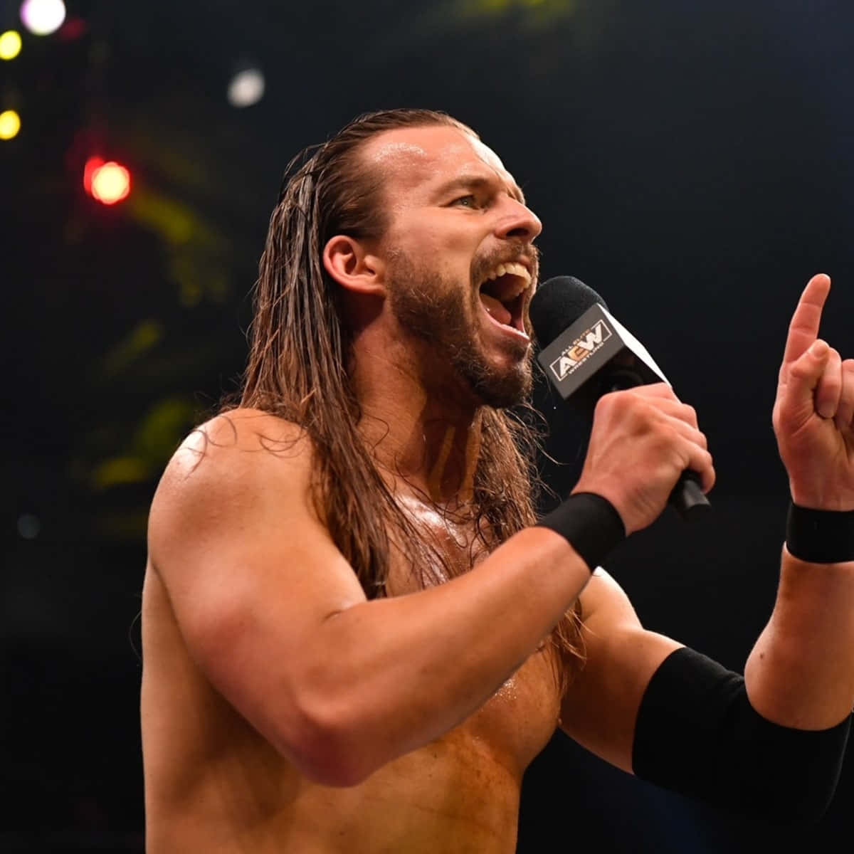 Adam Cole Holding A Microphone And Talking Background