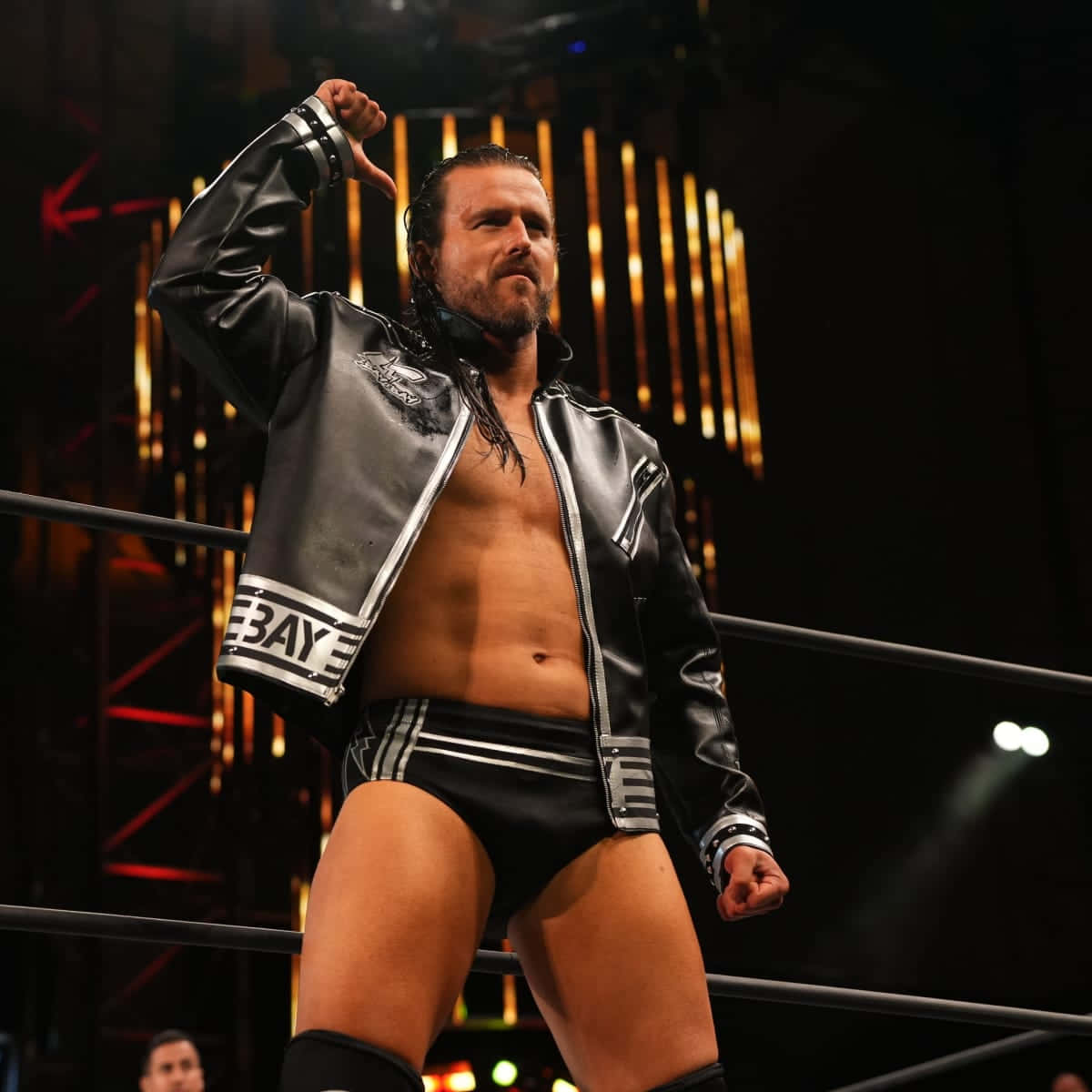 Adam Cole Standing And Pointing To Himself Background