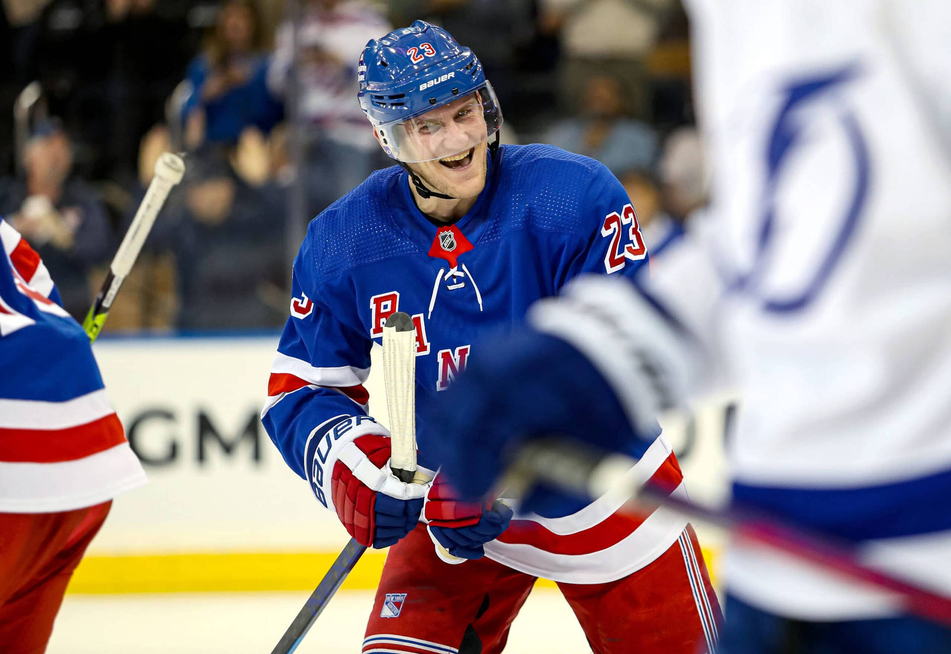 Adam Fox Smiling New York Rangers Background