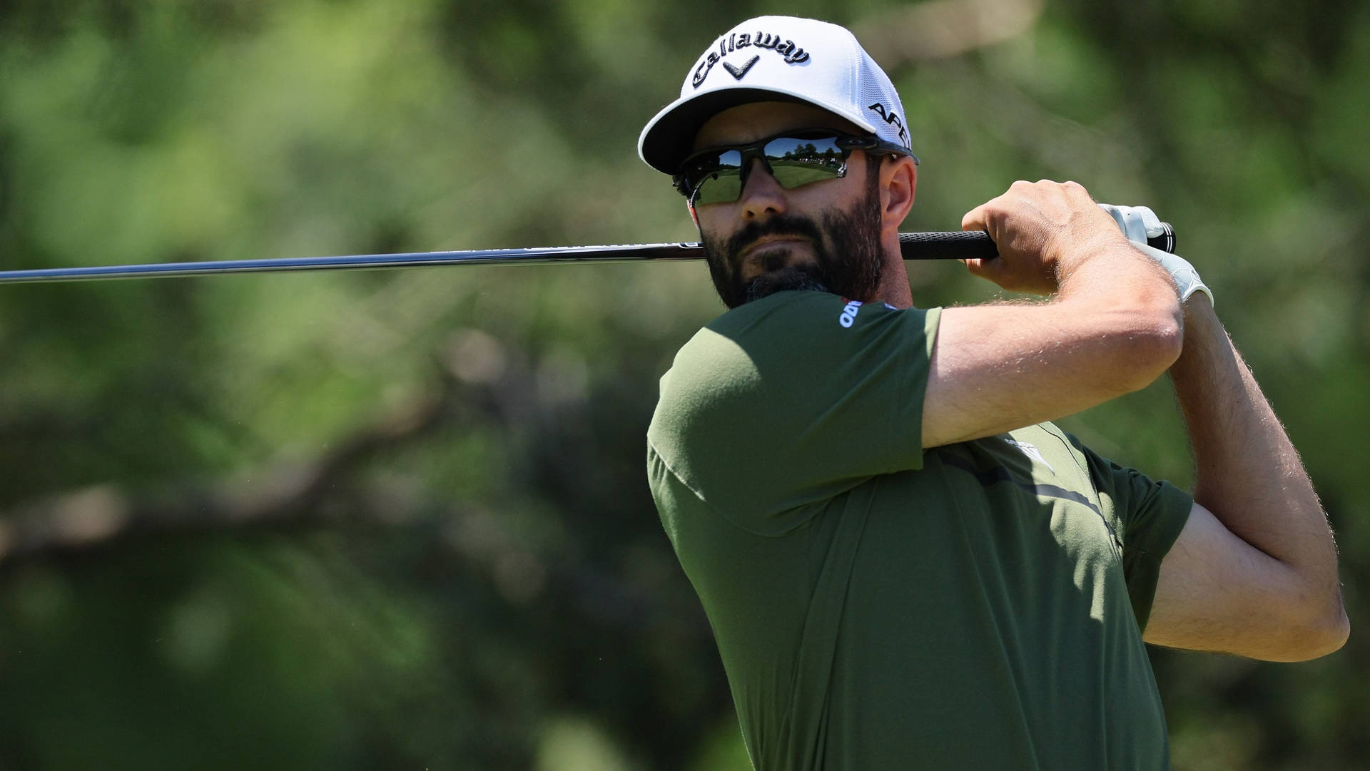 Adam Hadwin In-action During A Golf Tournament Background