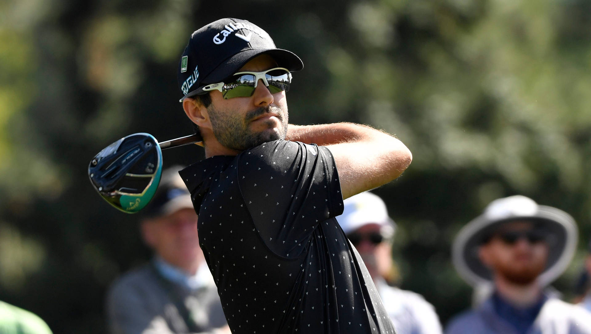 Adam Hadwin Swinging For Victory On The Golf Course Background