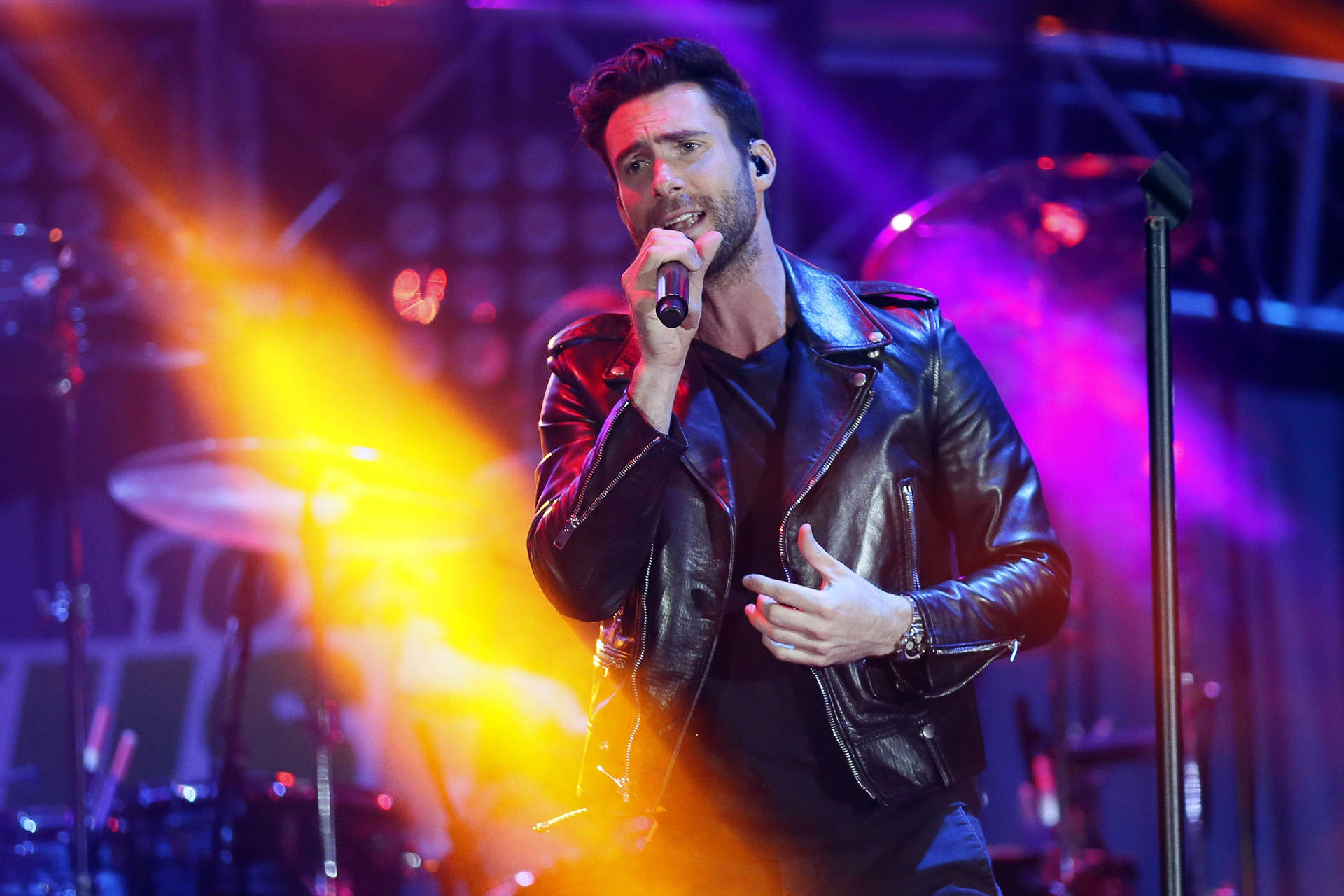 Adam Levine Flaunting His Style In A Black Leather Jacket Background
