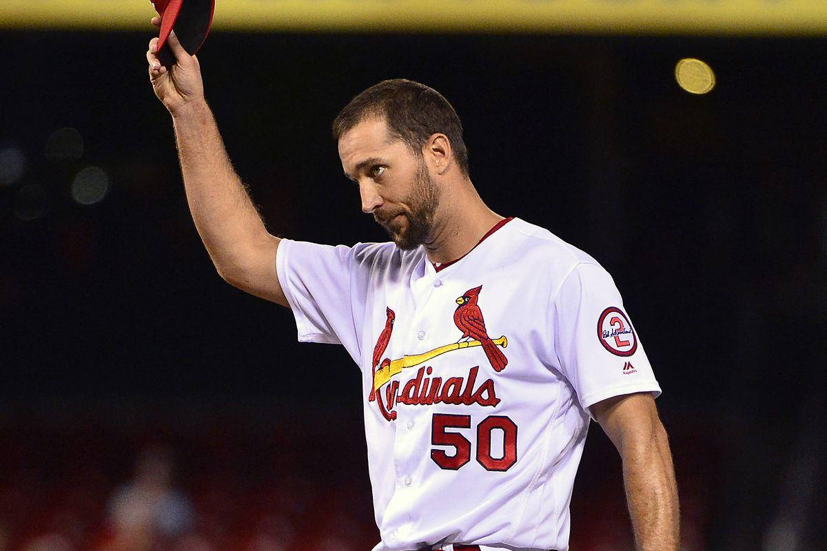 Adam Wainwright Saluting With Cap In Hand Background