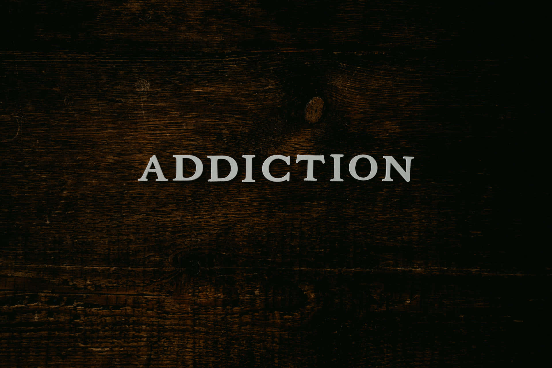 Addiction Text In Wood Background