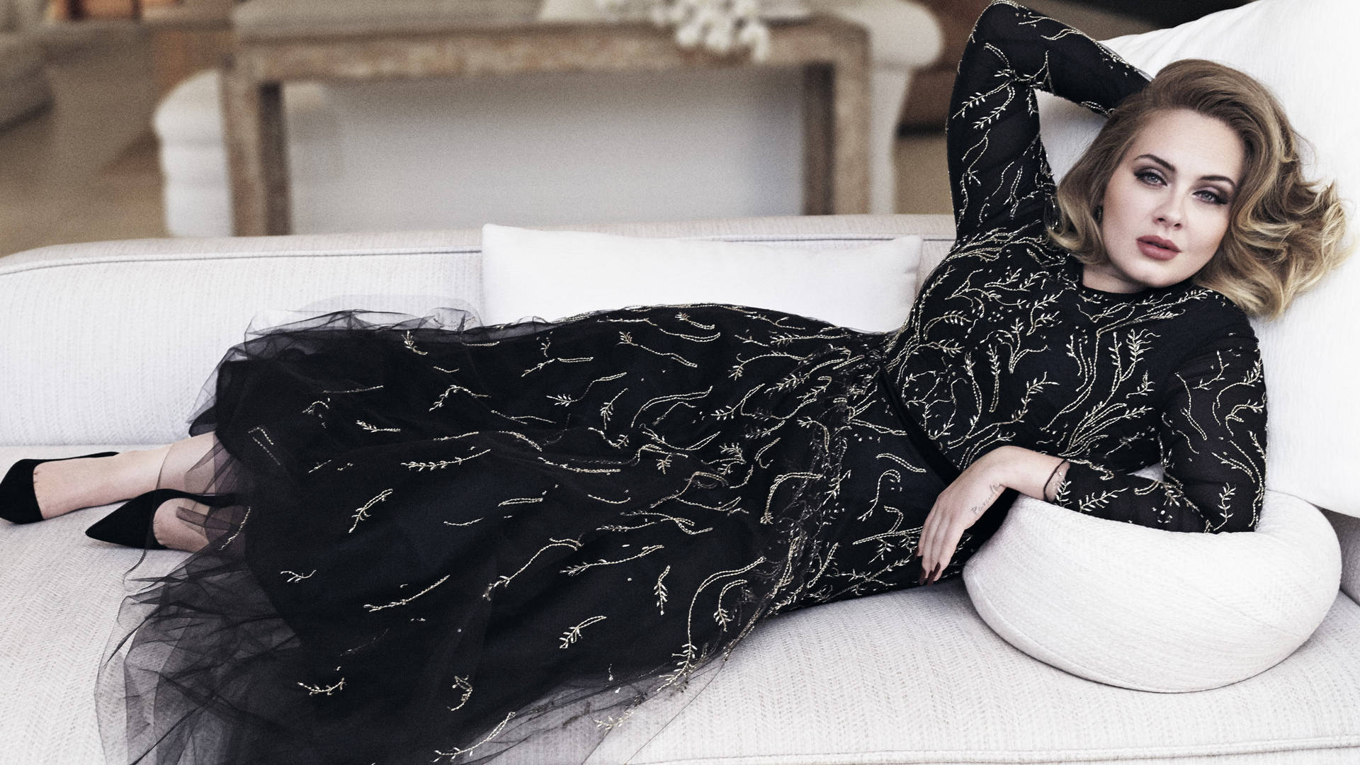 Adele Posing On A Sofa