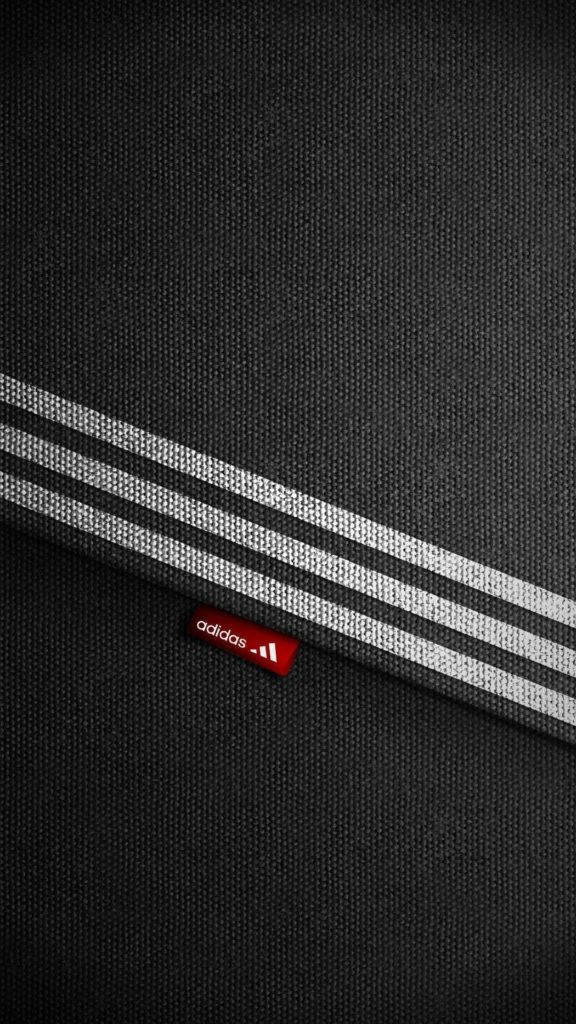 Adidas Iphone Logo On Fabric Material Background