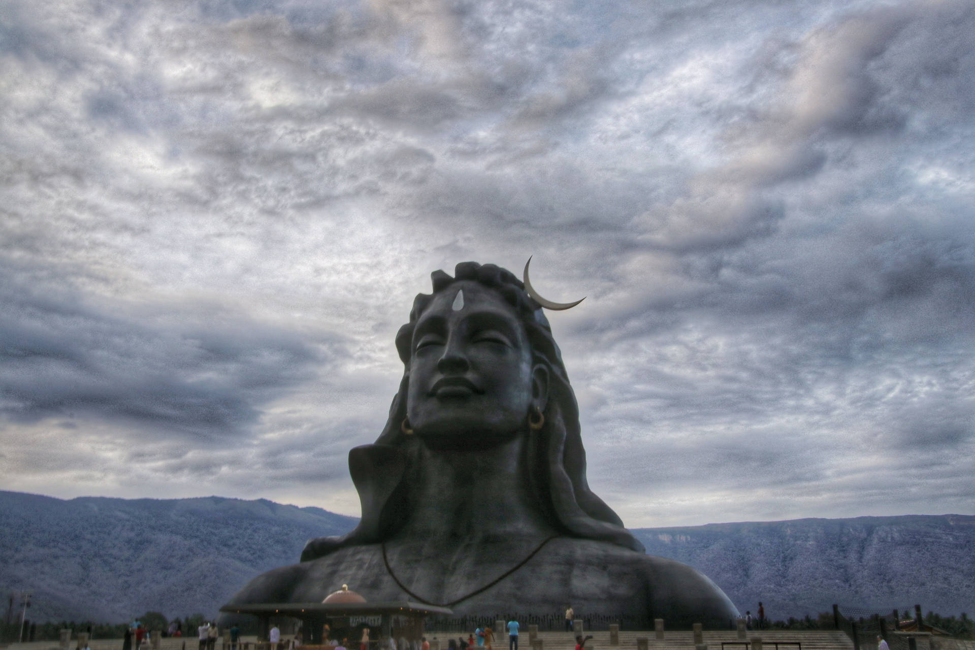 Adiyogi Shiva On A Cloudy Day Background