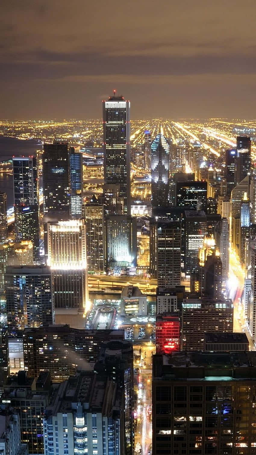 Admire The Beauty Of Chicago City At Night Background