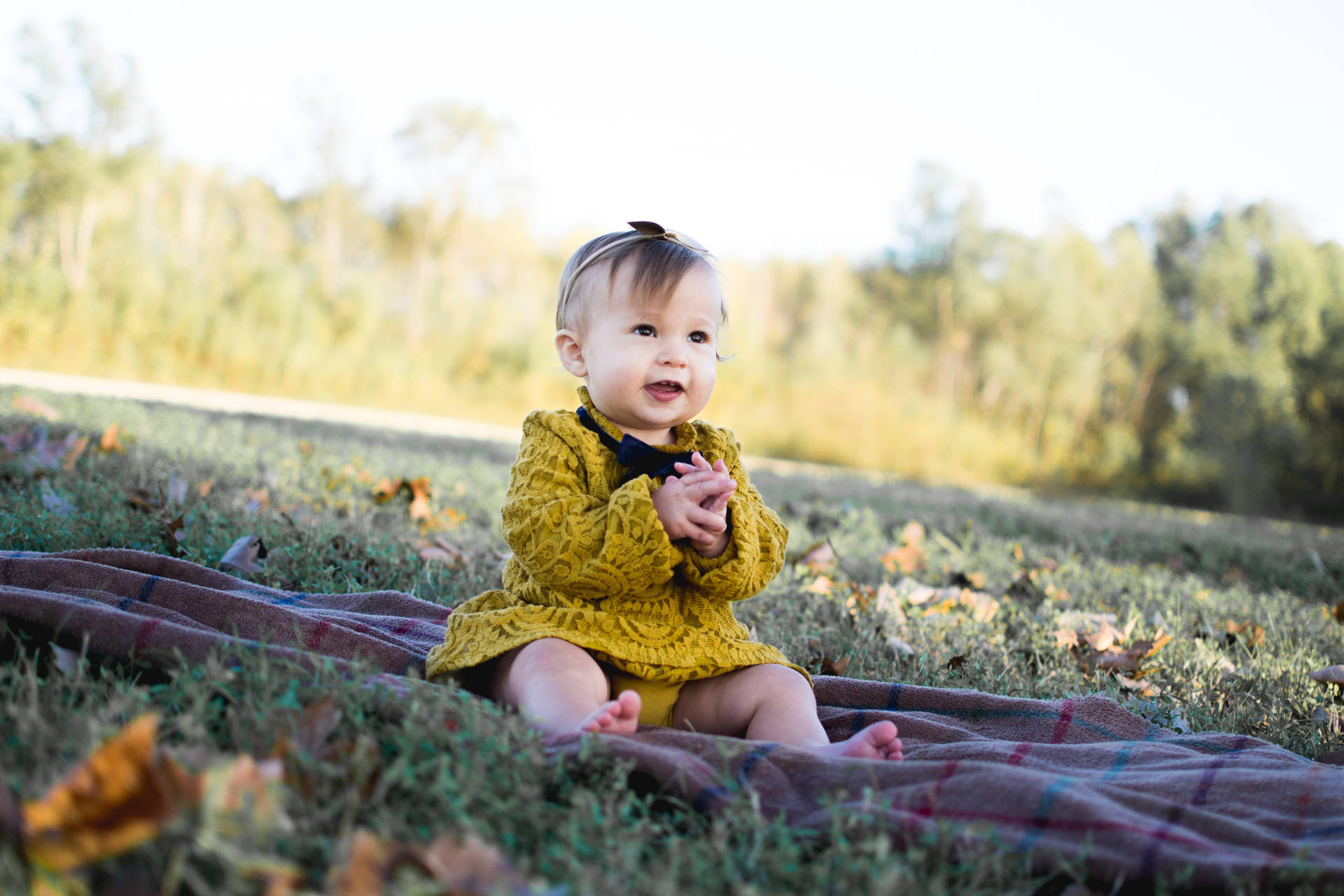 Adorable Baby Girl Enjoying Nature Background