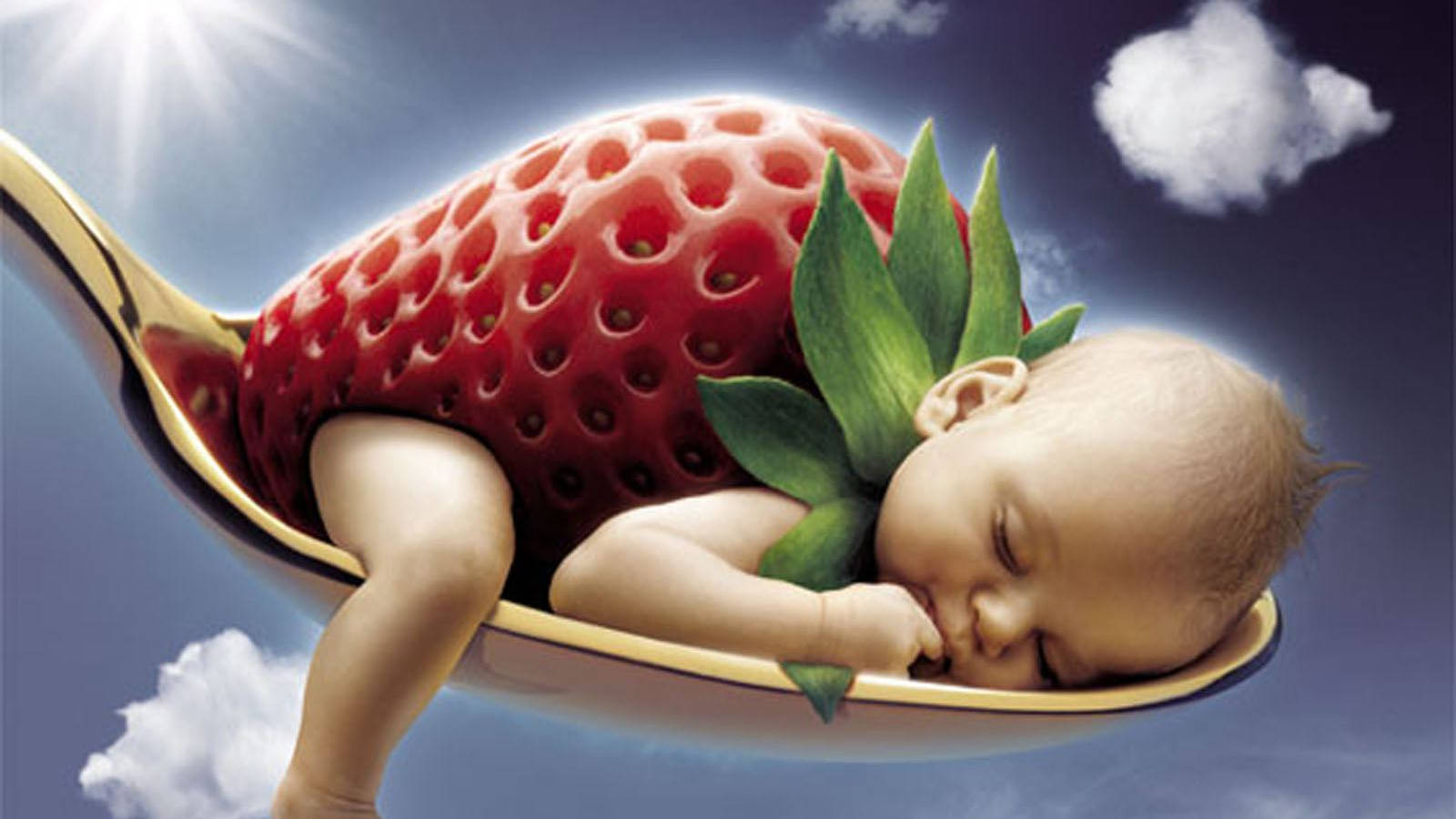 Adorable Baby In A Strawberry Outfit Laughing Joyously