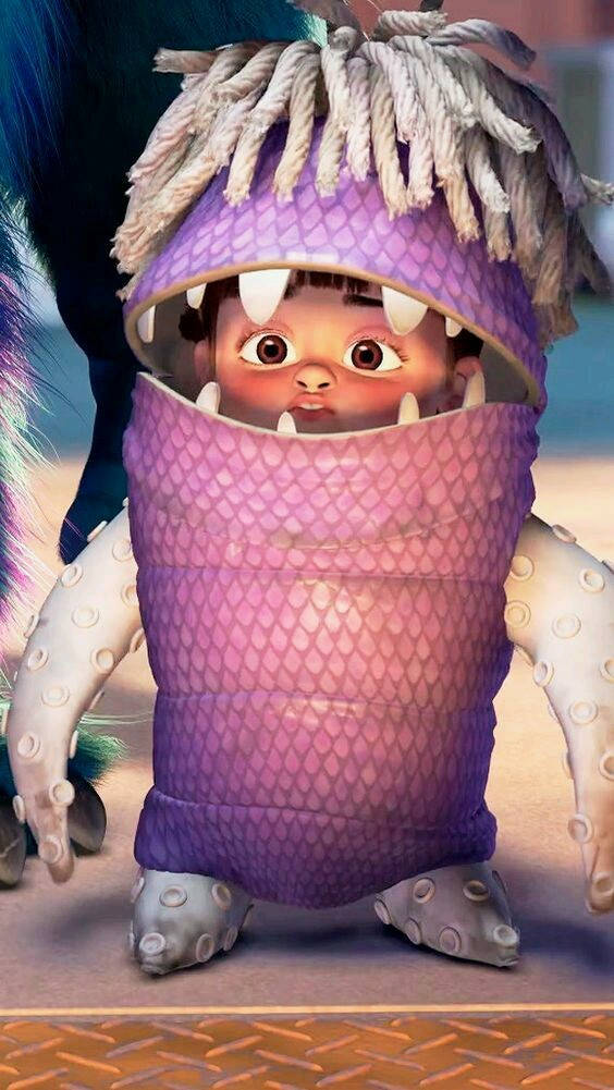 Adorable Boo In Costume From Monsters Inc Movie Background