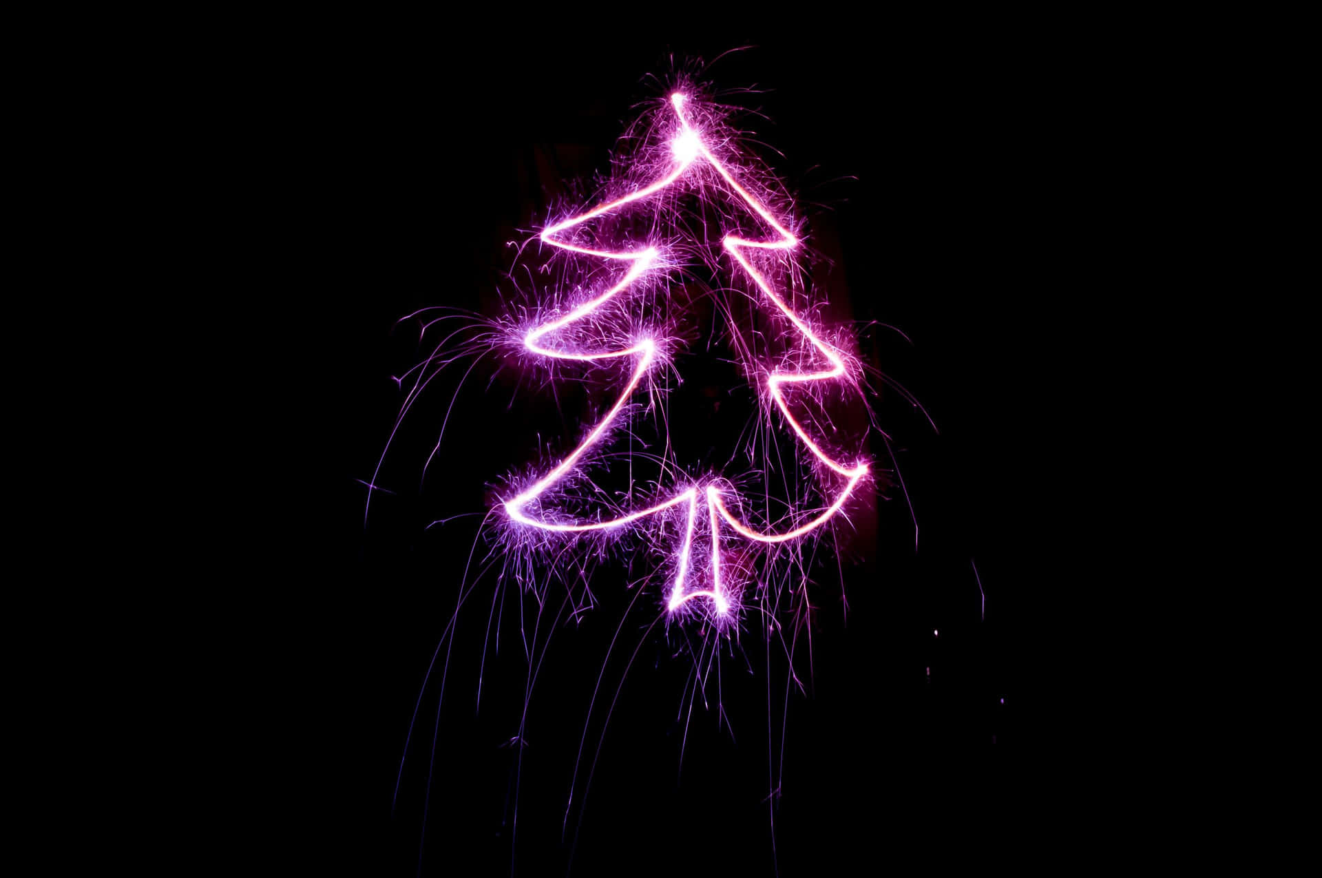 Adorable Christmas Tree Adorned In Gingerbreads, Candy Canes And Other Festive Decorations Background
