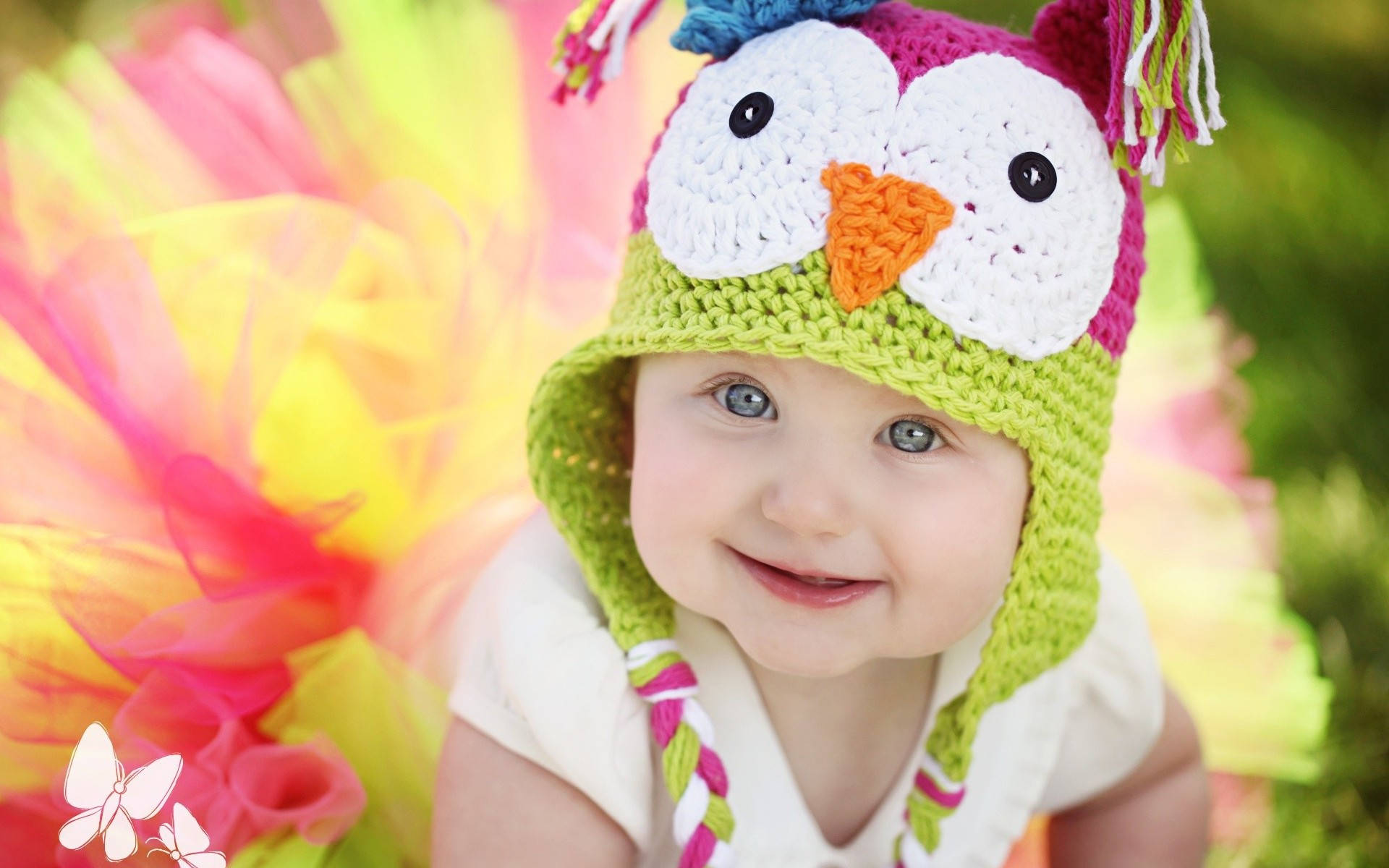 Adorable Crocheted Owl Embracing Baby Love Background