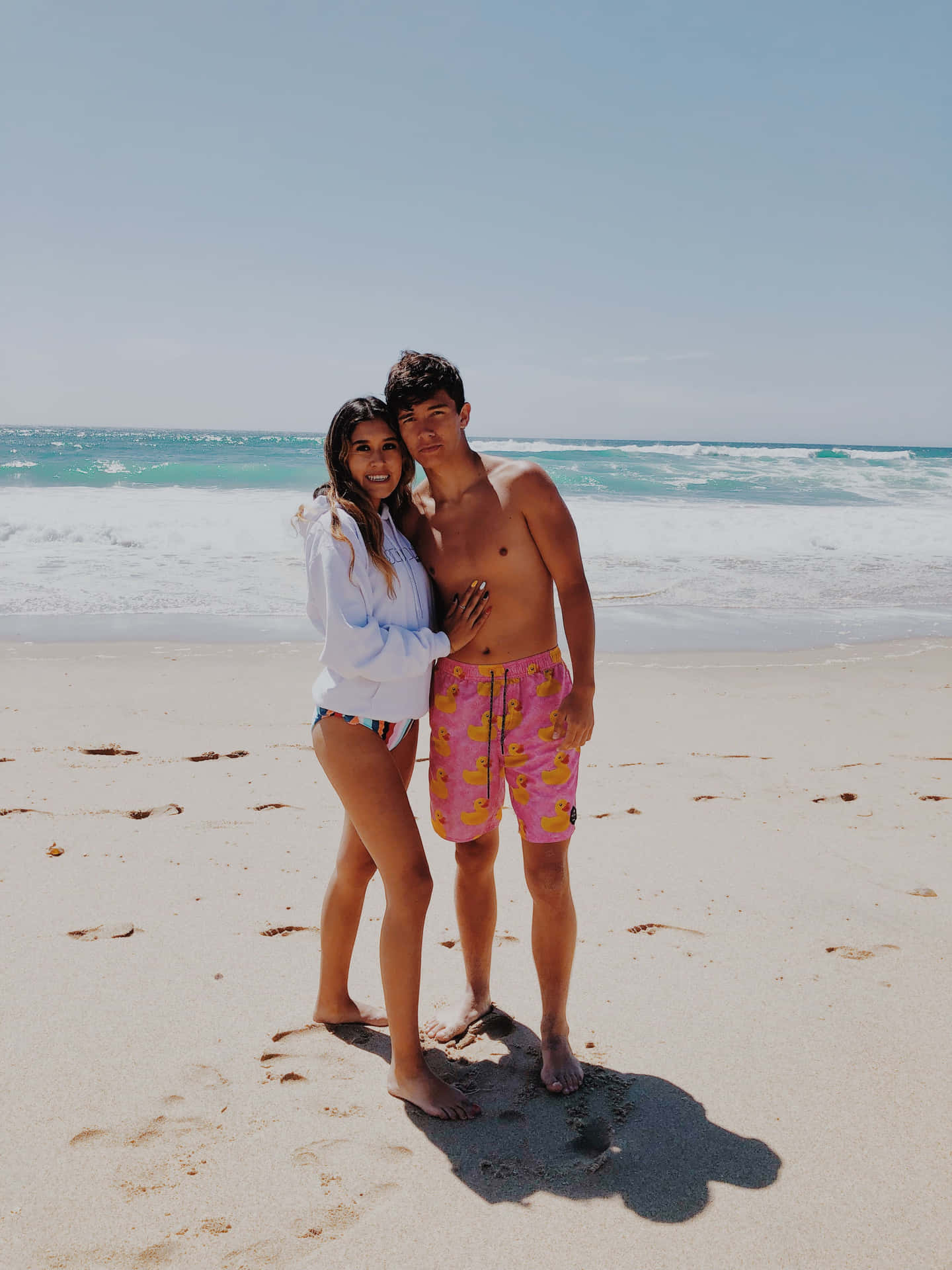 Adorable Hugging Couple At Beach Background