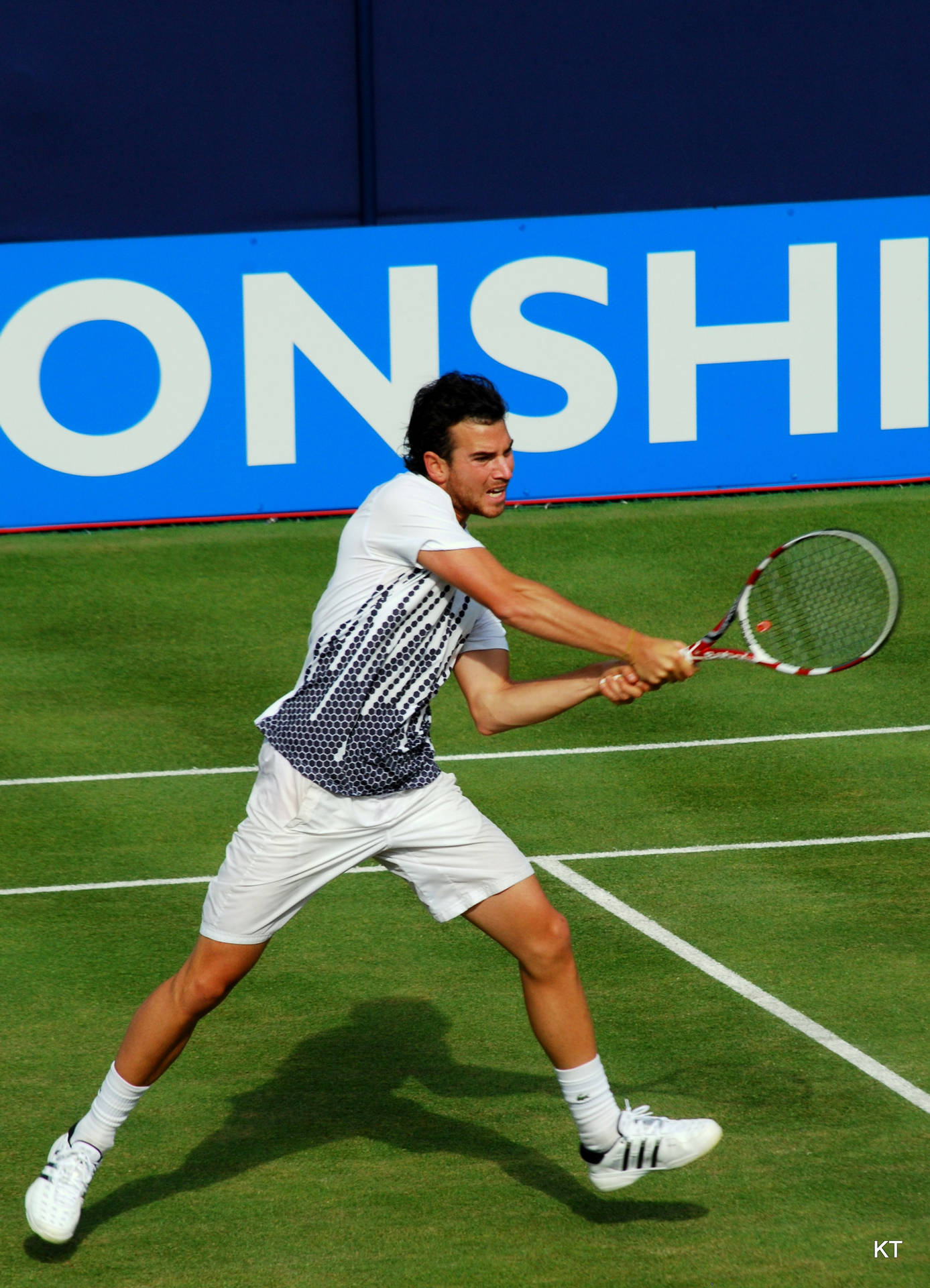 Adrian Mannarino Unleashing A Powerful Backhand Stroke In A Tennis Match