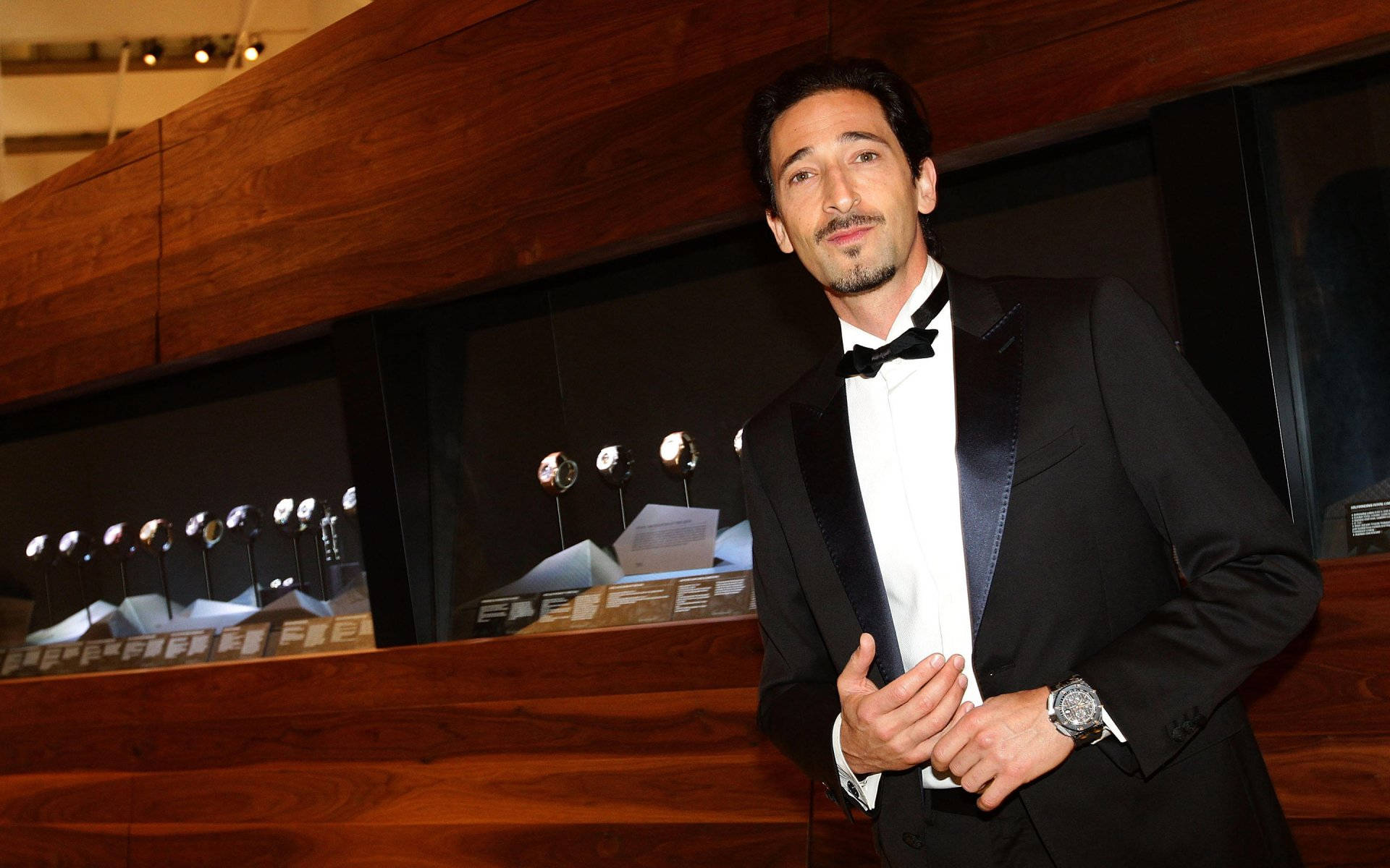 Adrien Brody Wearing A Bow Tie Background
