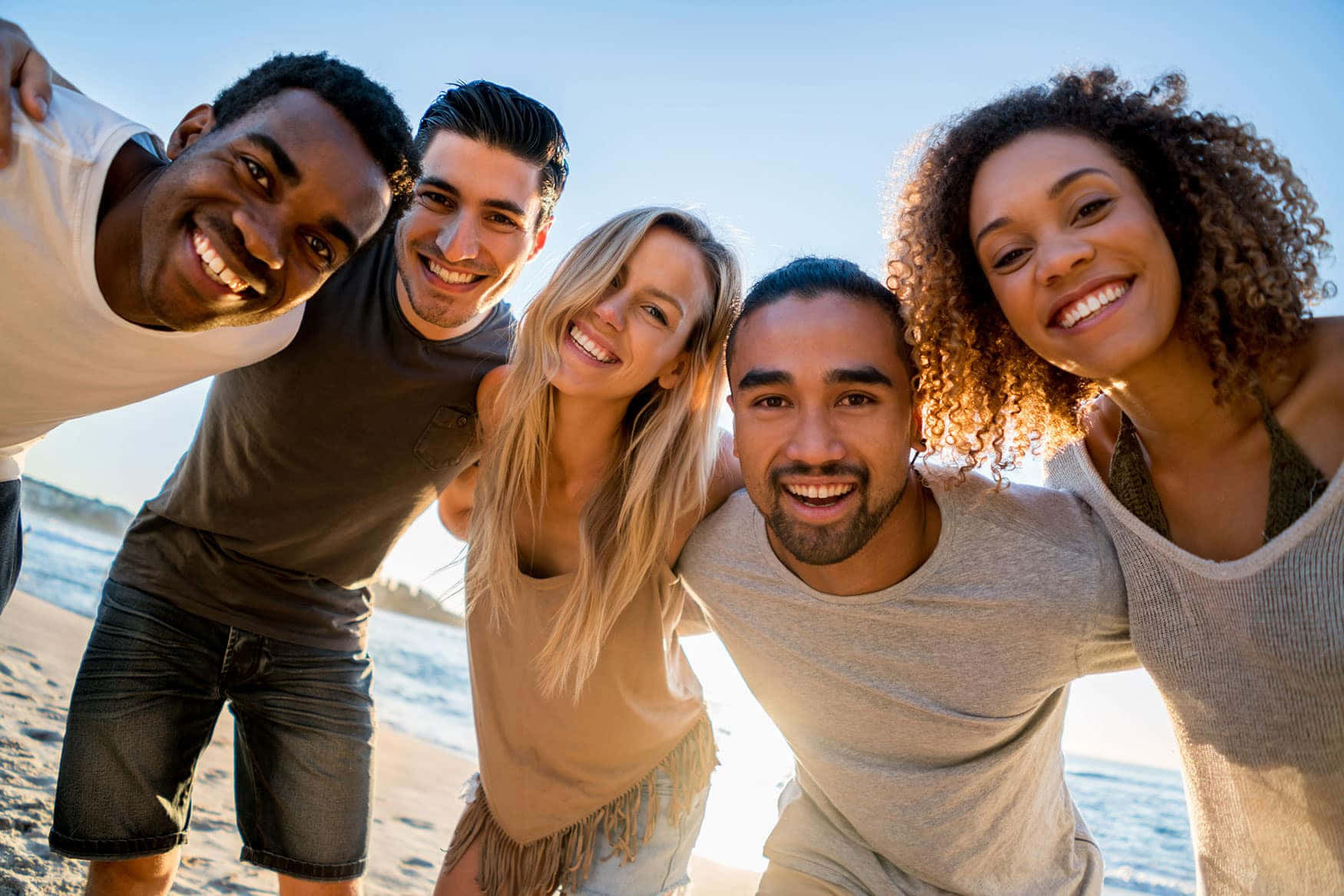 Adult Friends On Beach Background