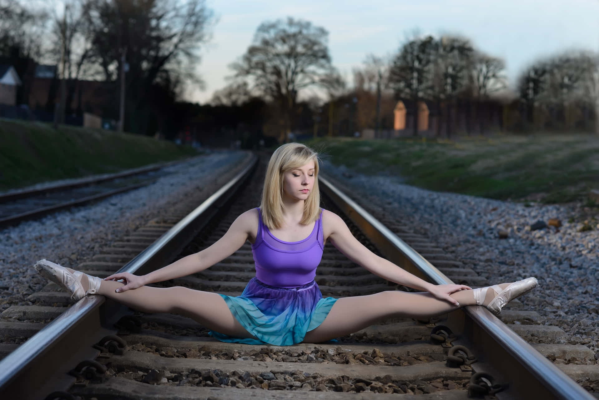 Adventurous Traveller Contemplating At Train Tracks Background