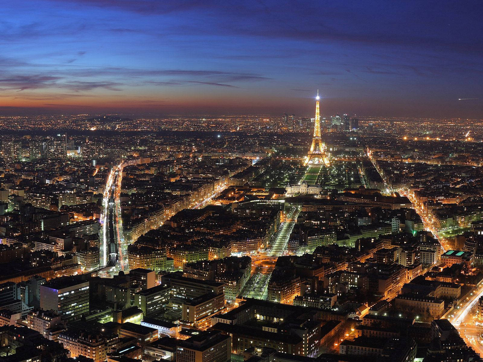 Aerial Night View Of The City Of Lights - Paris, France Background