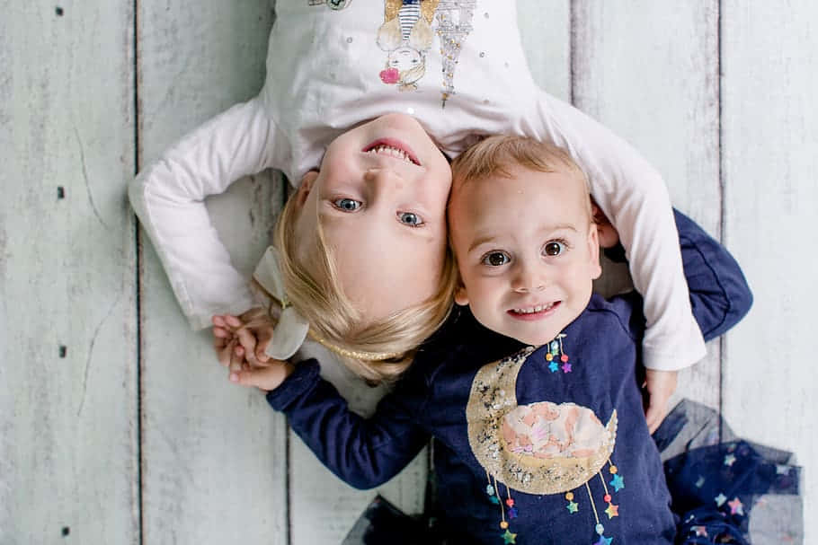 Aerial Photography Of Boy And His Cute Sister