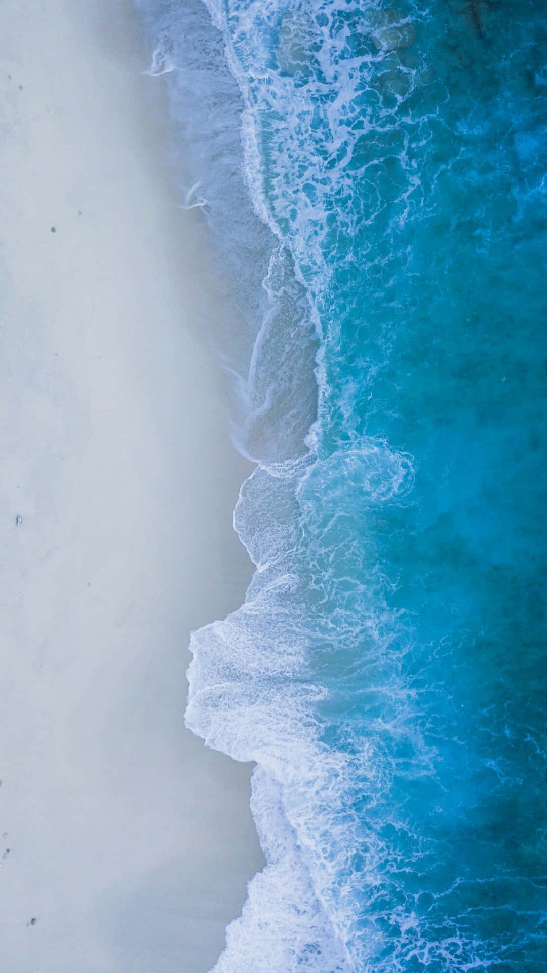 Aerial_ View_ Crystal_ Blue_ Waves_ Beach_4 K_ U H D.jpg Background