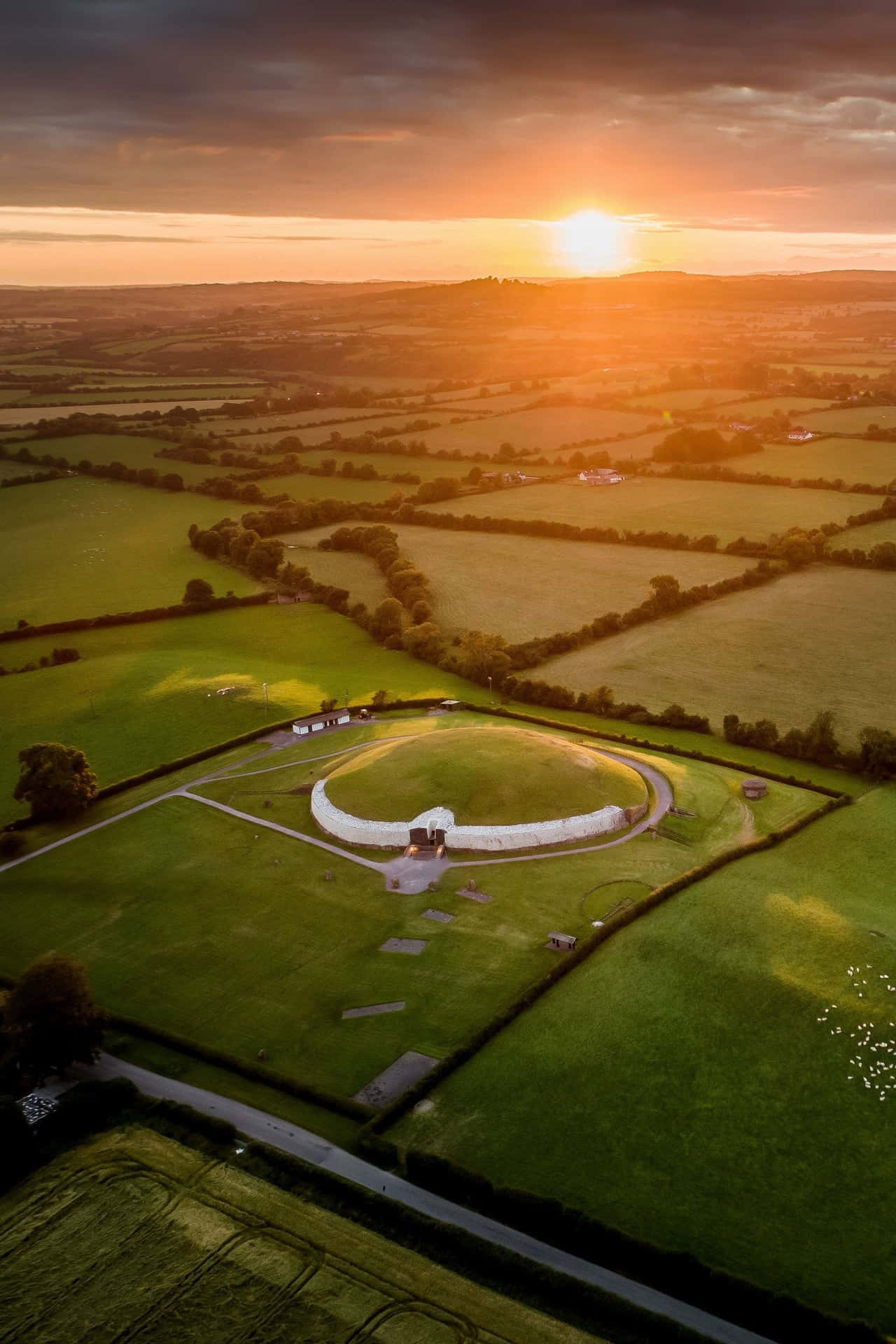 Aerial View Newgrange With Sunset Background