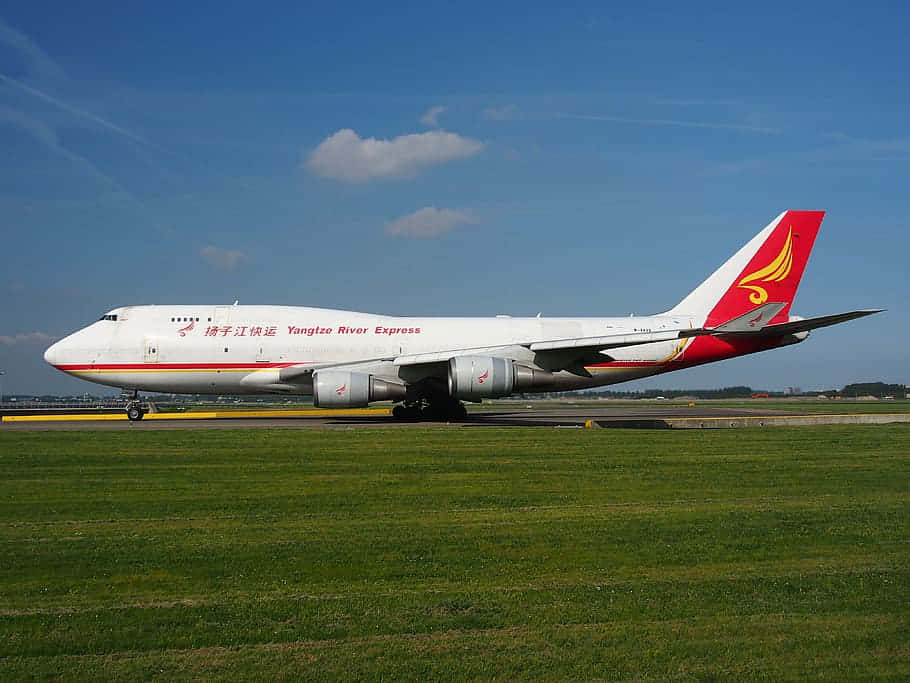 Aerial View Of A Jumbo Jet Soaring Through The Clouds. Background