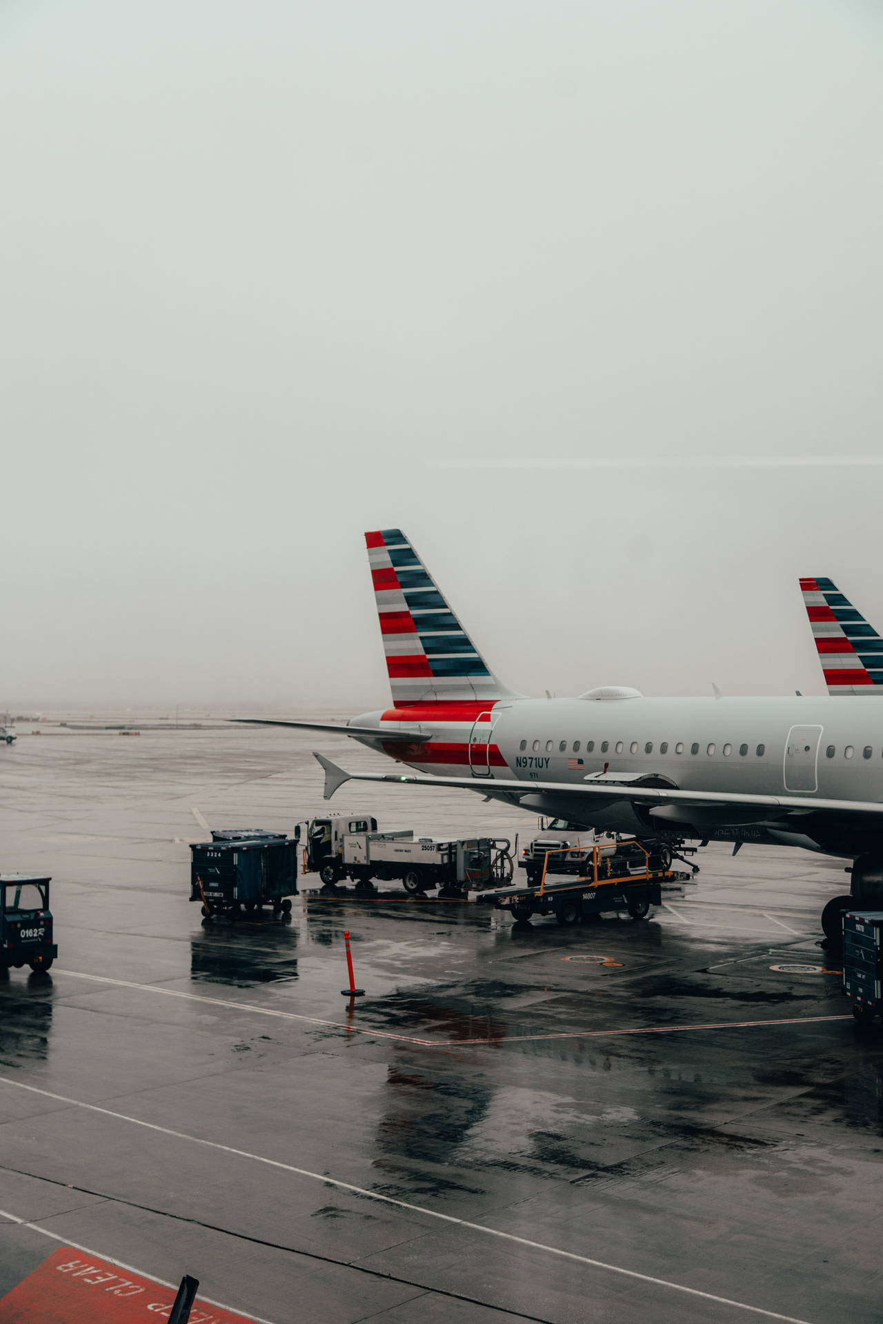 Aerial View Of A Wet Airplane Ramp At An Airport Background