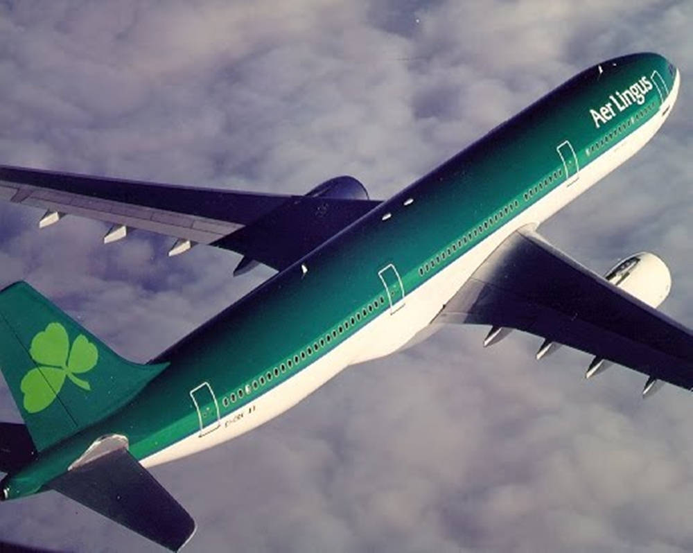 Aerial View Of Flying Aer Lingus Airplane Background