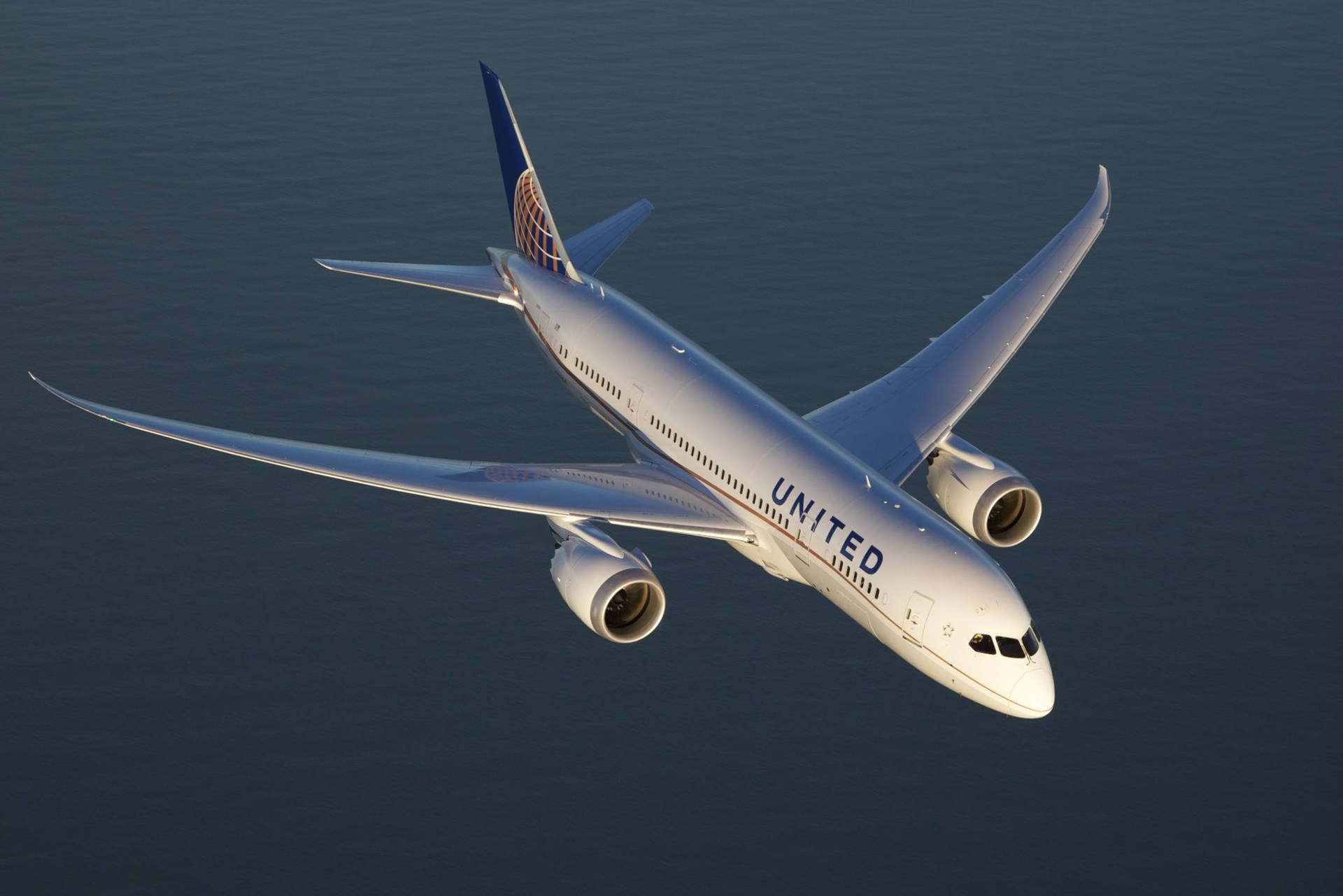 Aerial View Of Flying United Airplane Background