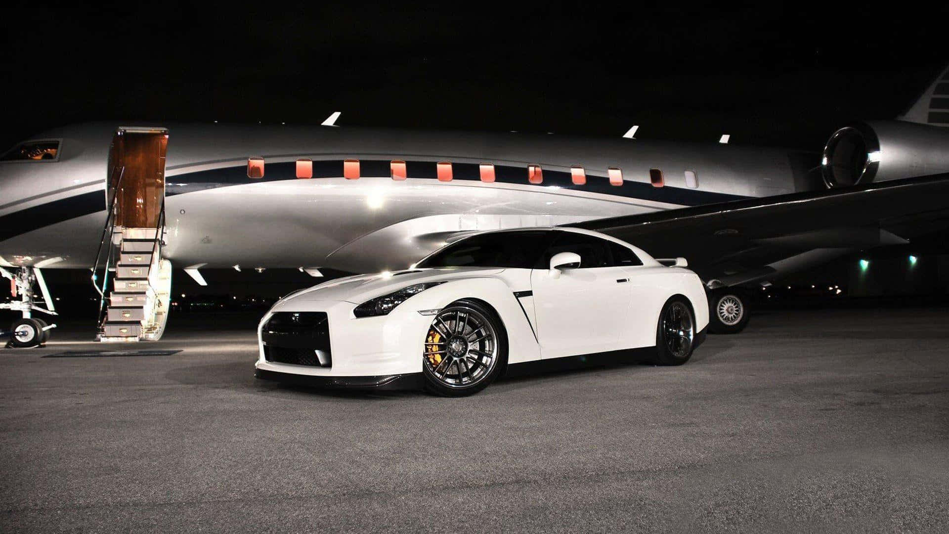 Aerial View Of Luxury Car And Jet Race Background