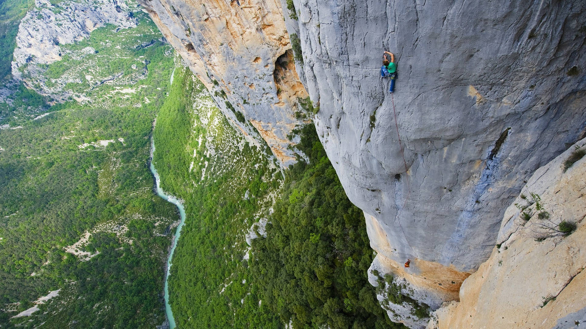 Aerial View Of Man Rock Climbing Background