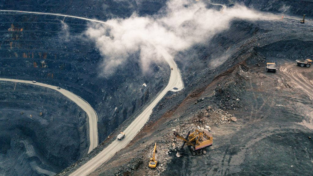 Aerial View Of Olimpiada Goldmines In Russia Background