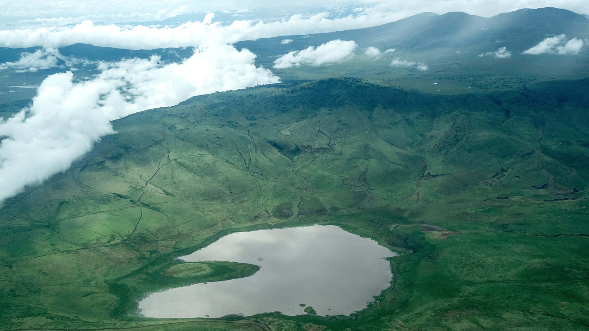Aerial View Of The Majestic Ngorongoro Crater Lake Magadi Background