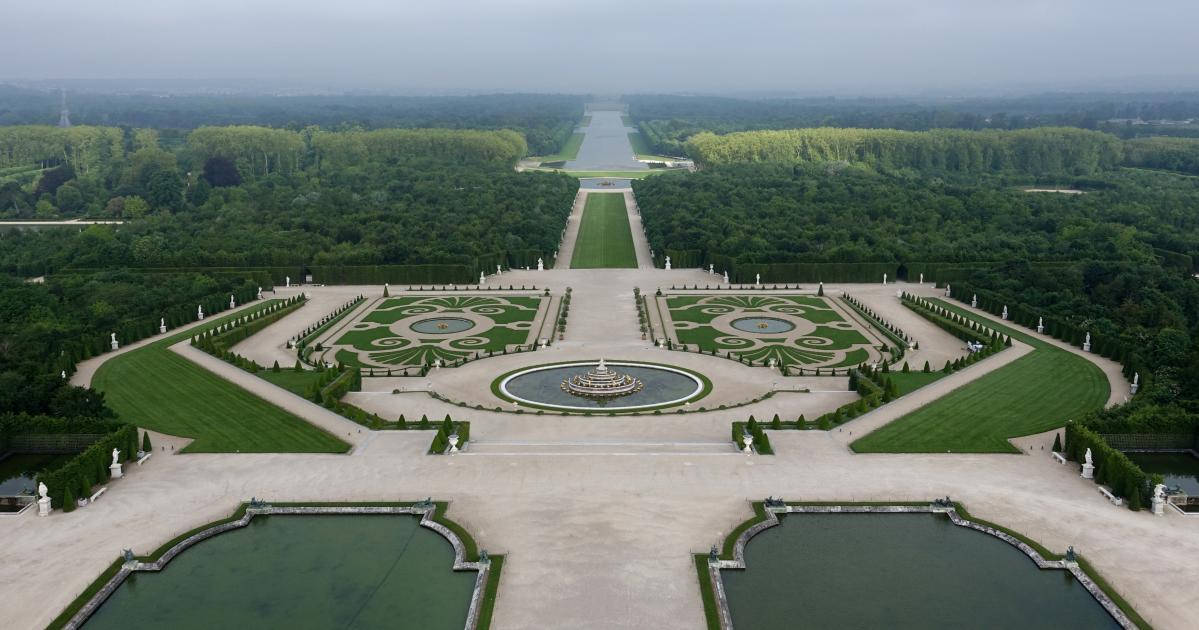 Aerial View Of The Majestic Palace Of Versailles Background