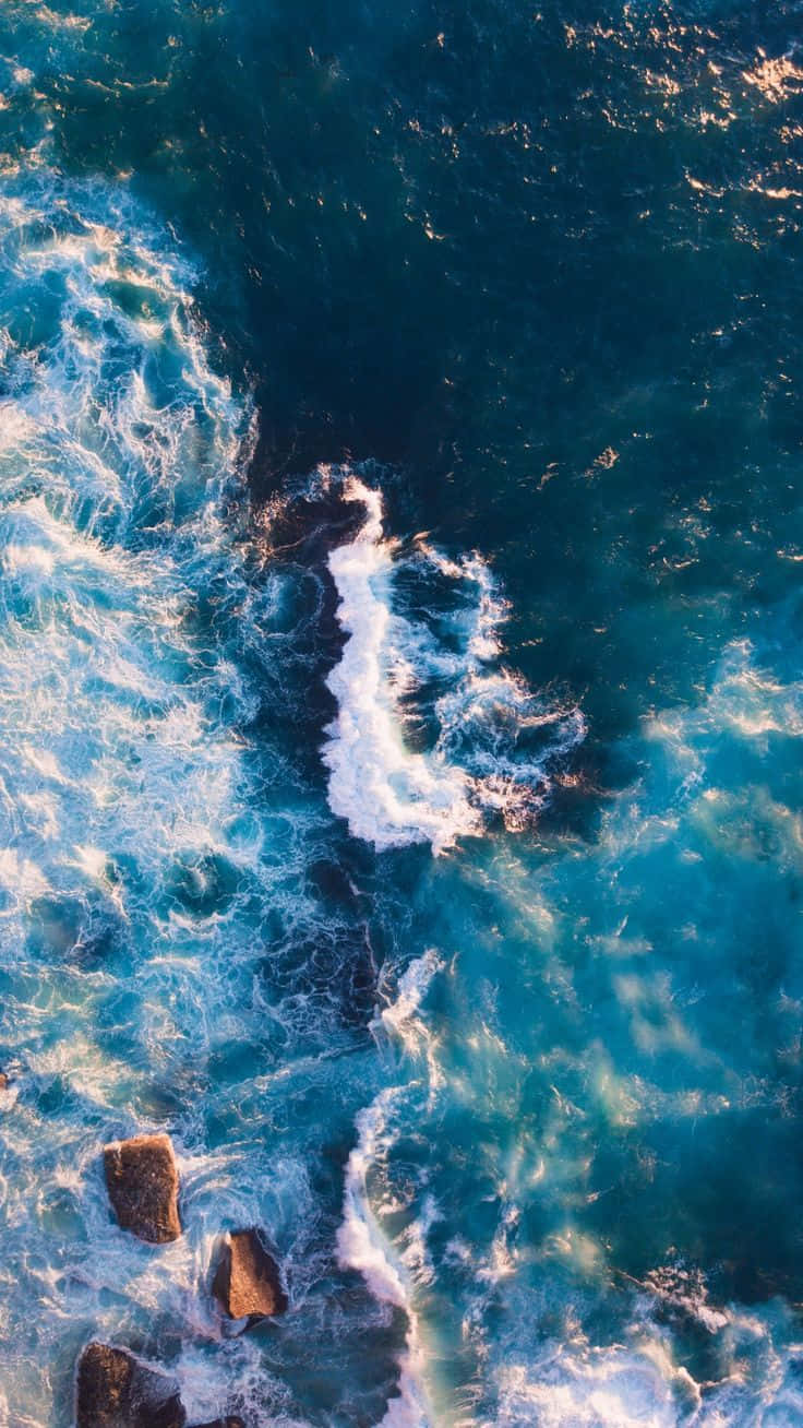 Aerial View4 K Ultra H D Ocean Waves Crashing Rocks Background