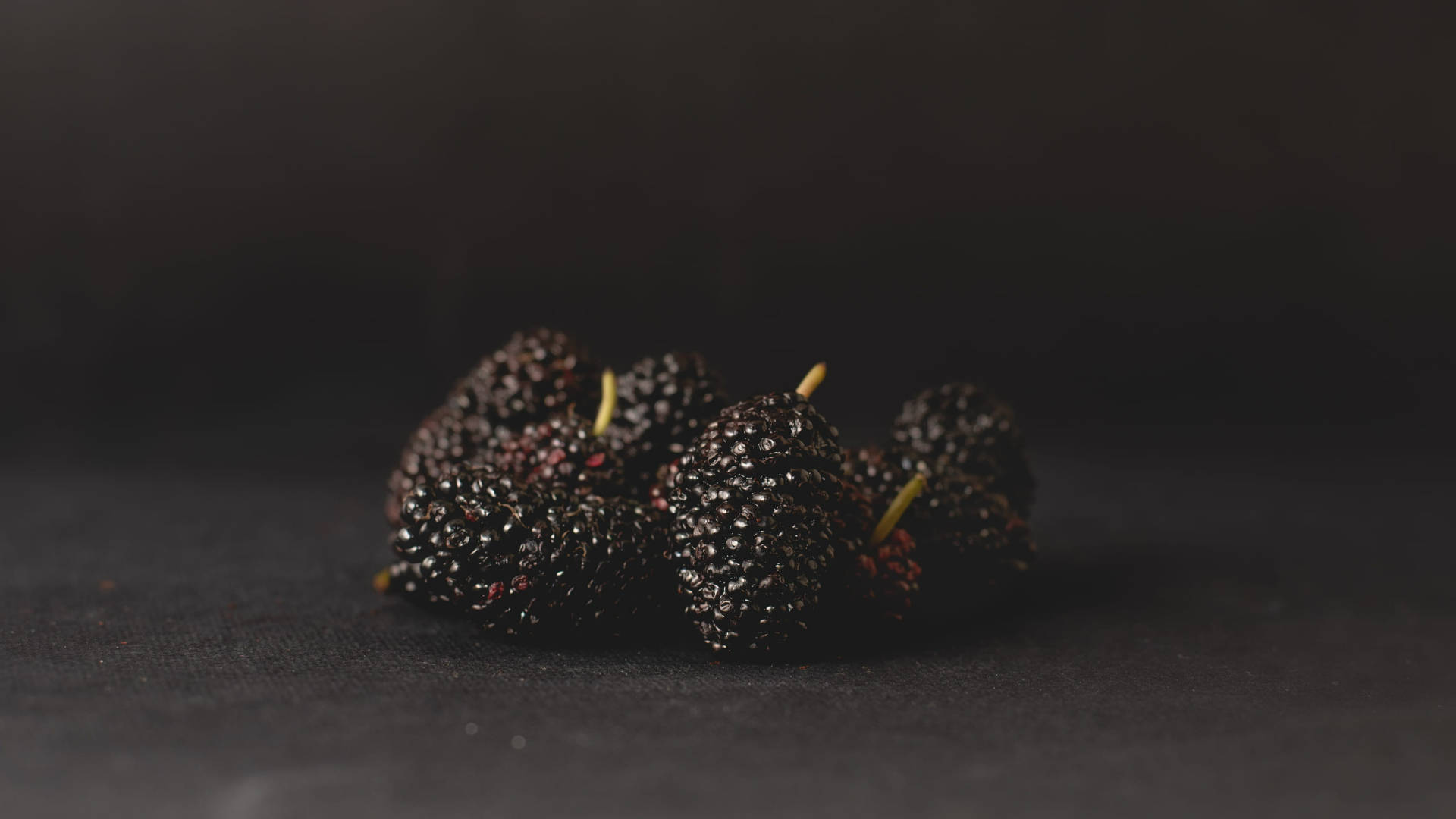 Aesthetic Black Mulberry Fruits On Black Background