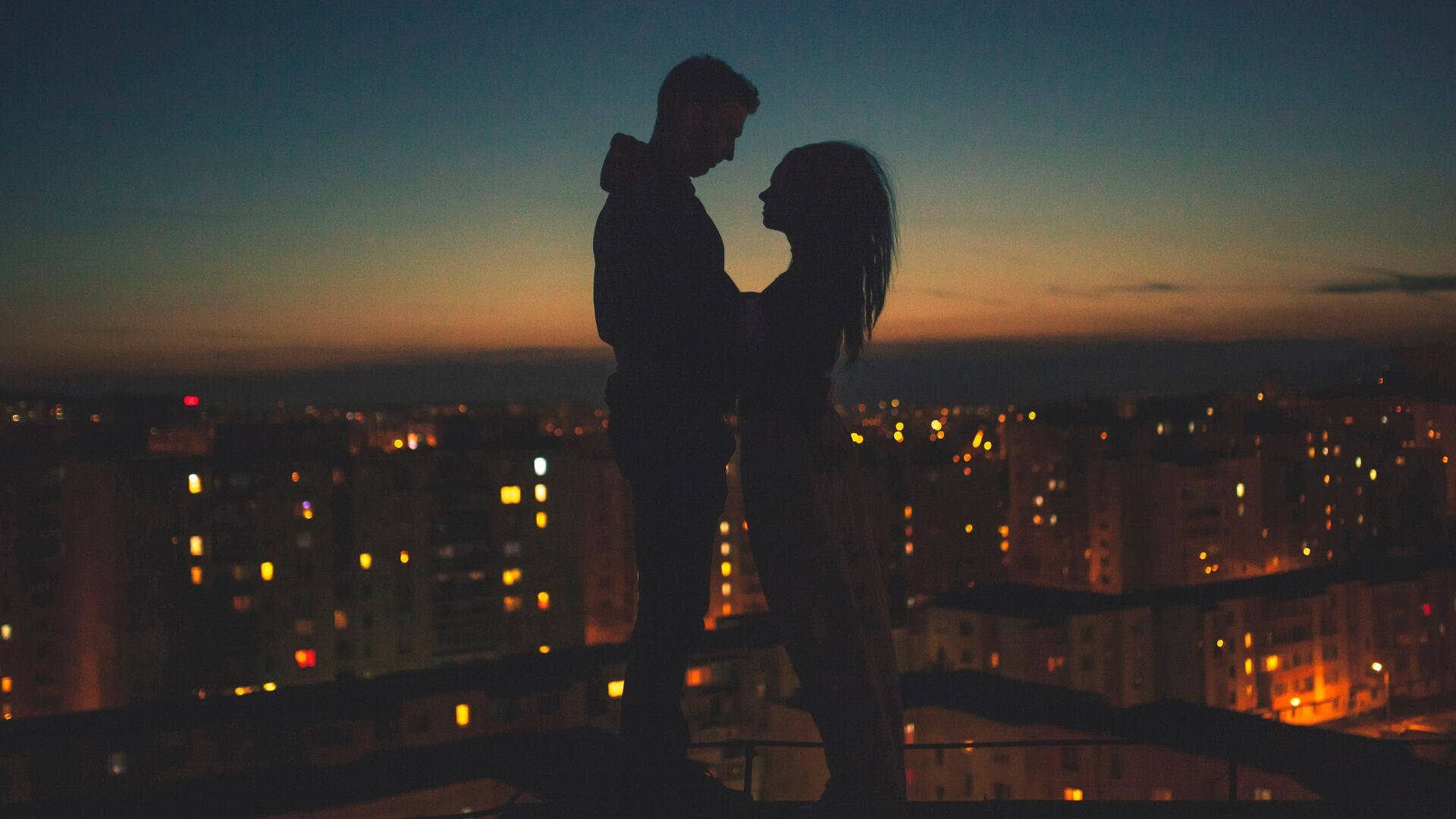 Aesthetic Couple Above A Building Background