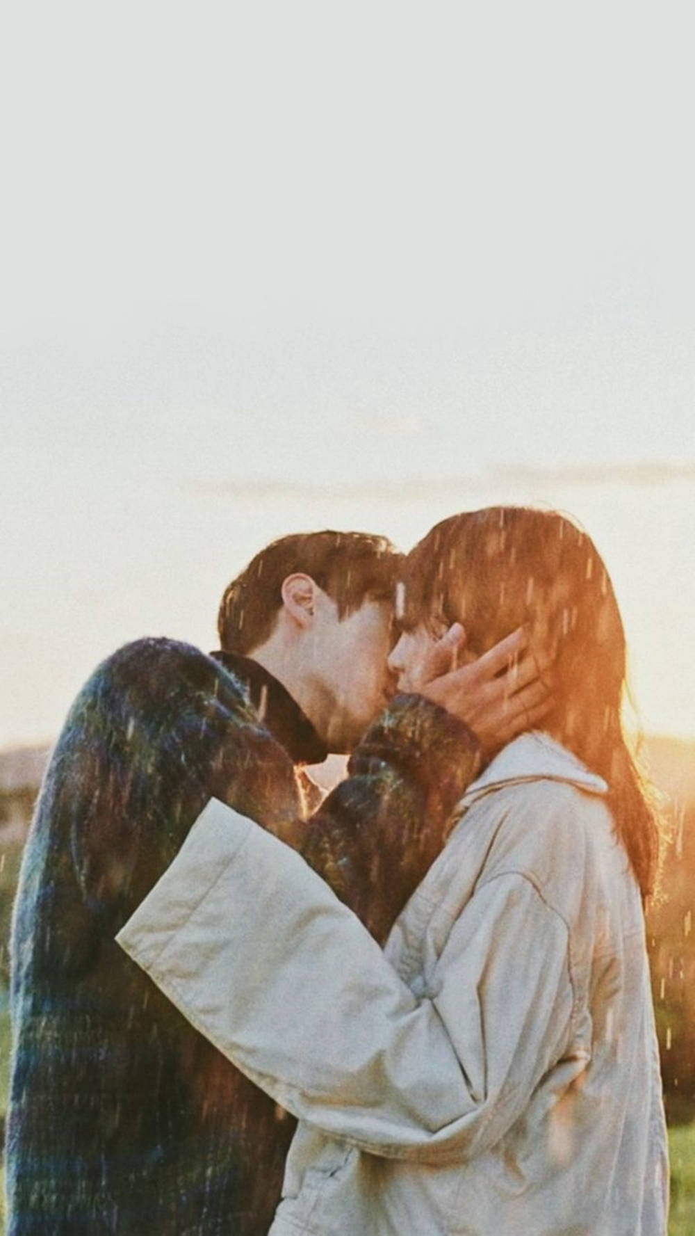 Aesthetic Couple Kissing In Rain Background