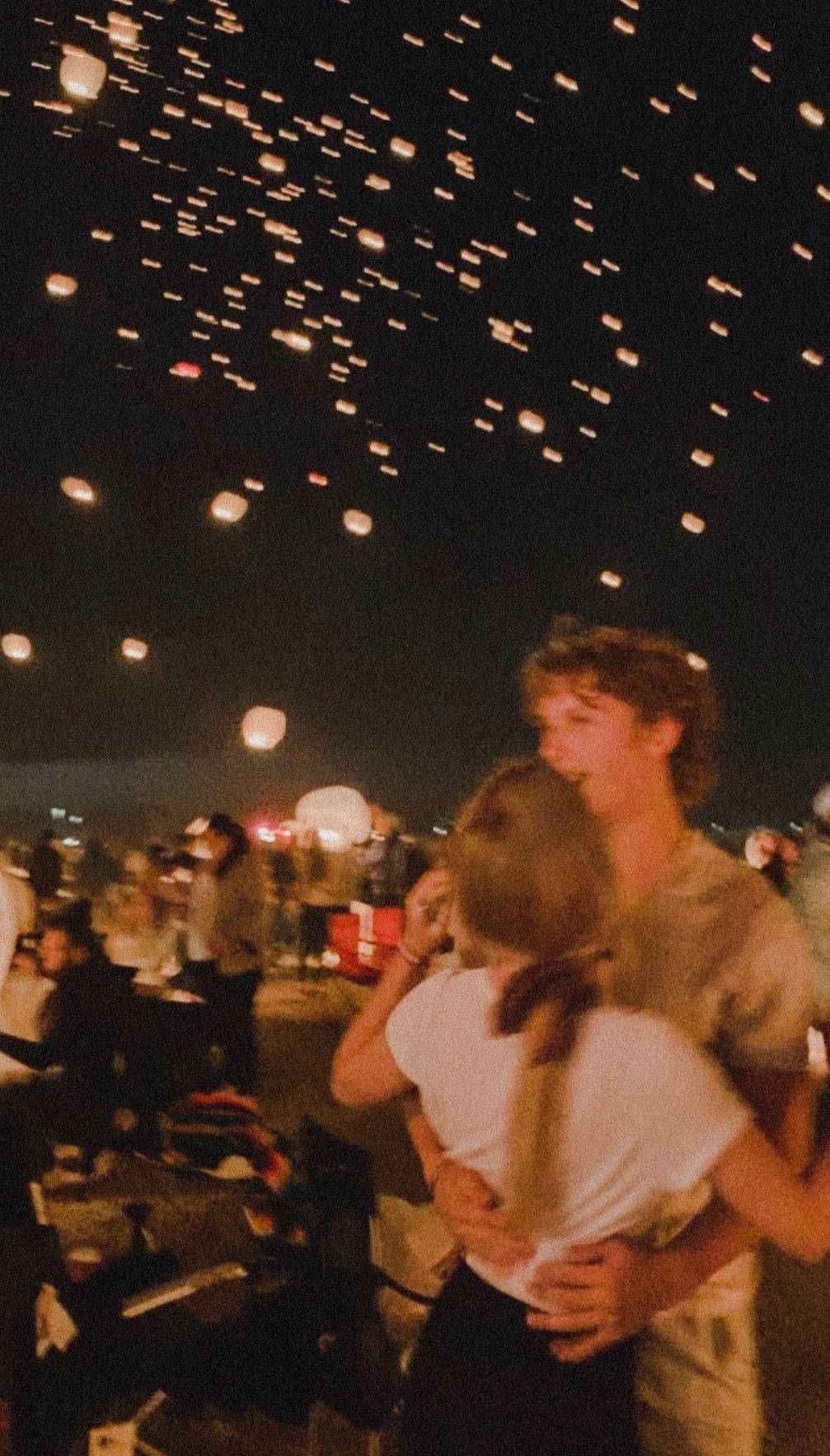 Aesthetic Couple With Flying Lanterns Background